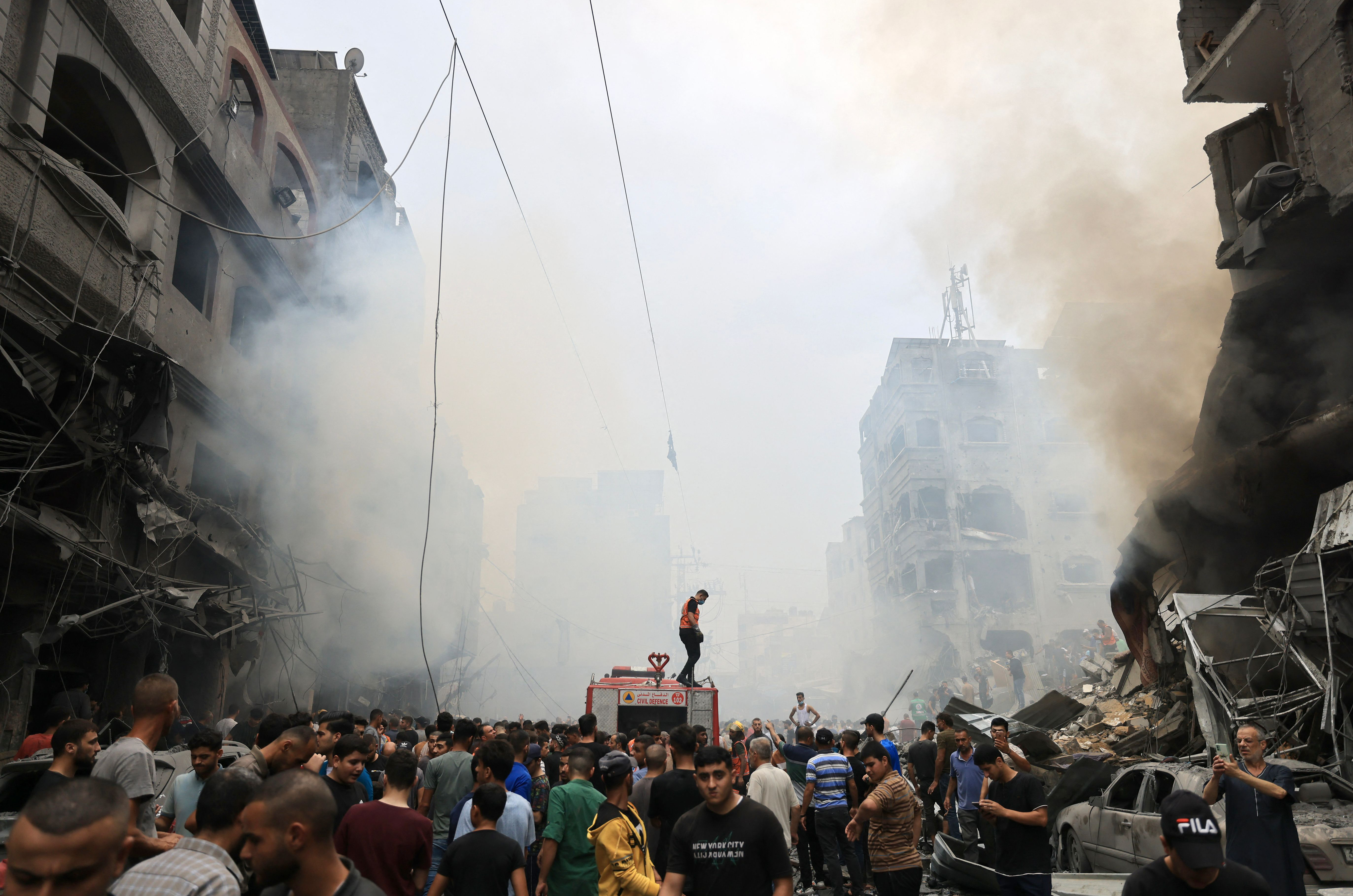 Mon., Oct. 9: Palestinians search for survivors after an Israeli airstrike on buildings in the refugee camp of Jabalia in the Gaza Strip.