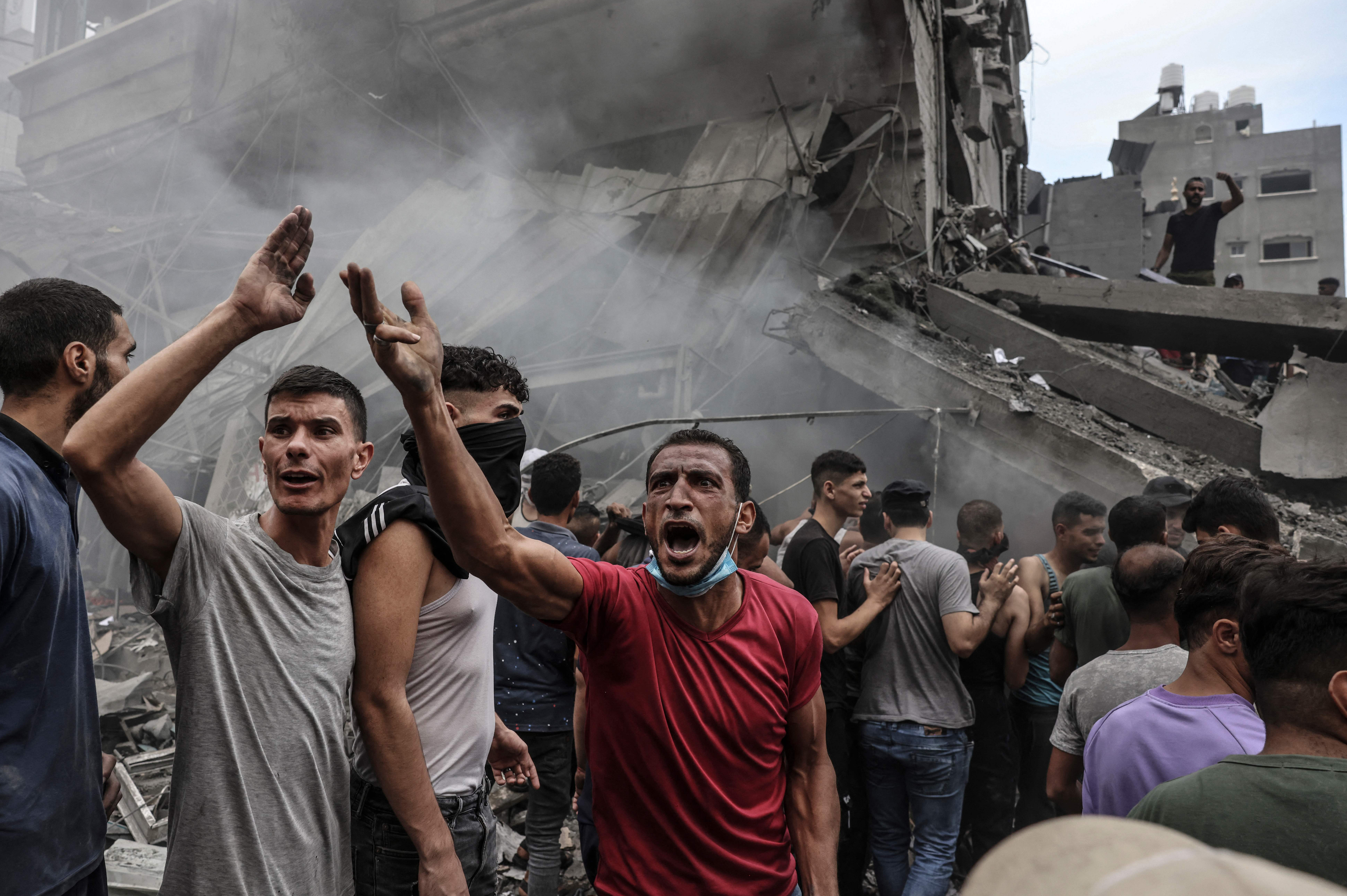 Mon., Oct. 9: Palestinians search for survivors after an Israeli airstrike on buildings in the refugee camp of Jabalia in the Gaza Strip.
