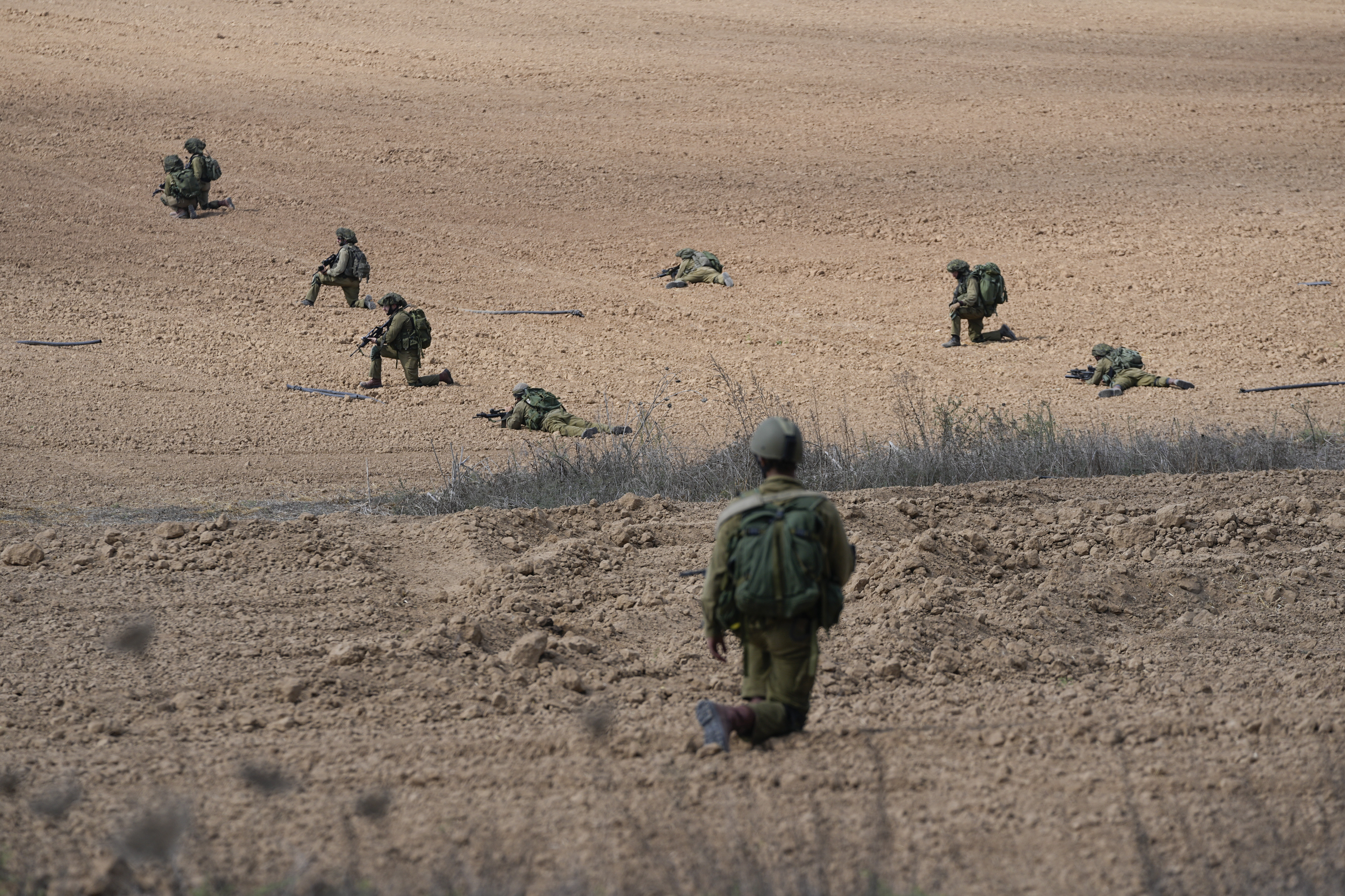 Tues., Oct. 10: Israeli soldiers take positions near Kibbutz Kfar Azza.