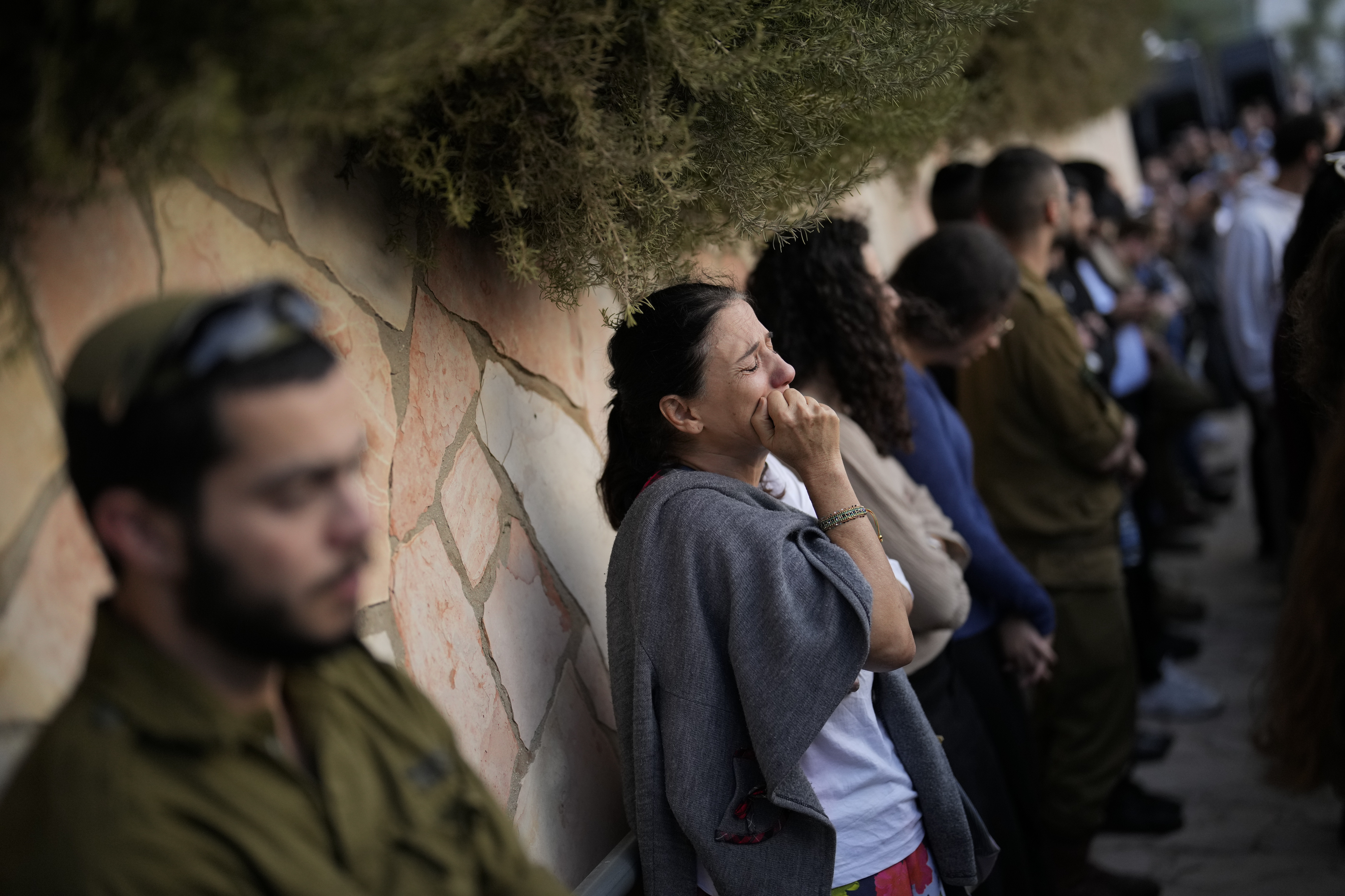 Tues., Oct. 10: Mourners react during the funeral of Israeli soldier Benjamin Loeb, a dual Israeli-French citizen, in Jerusalem.