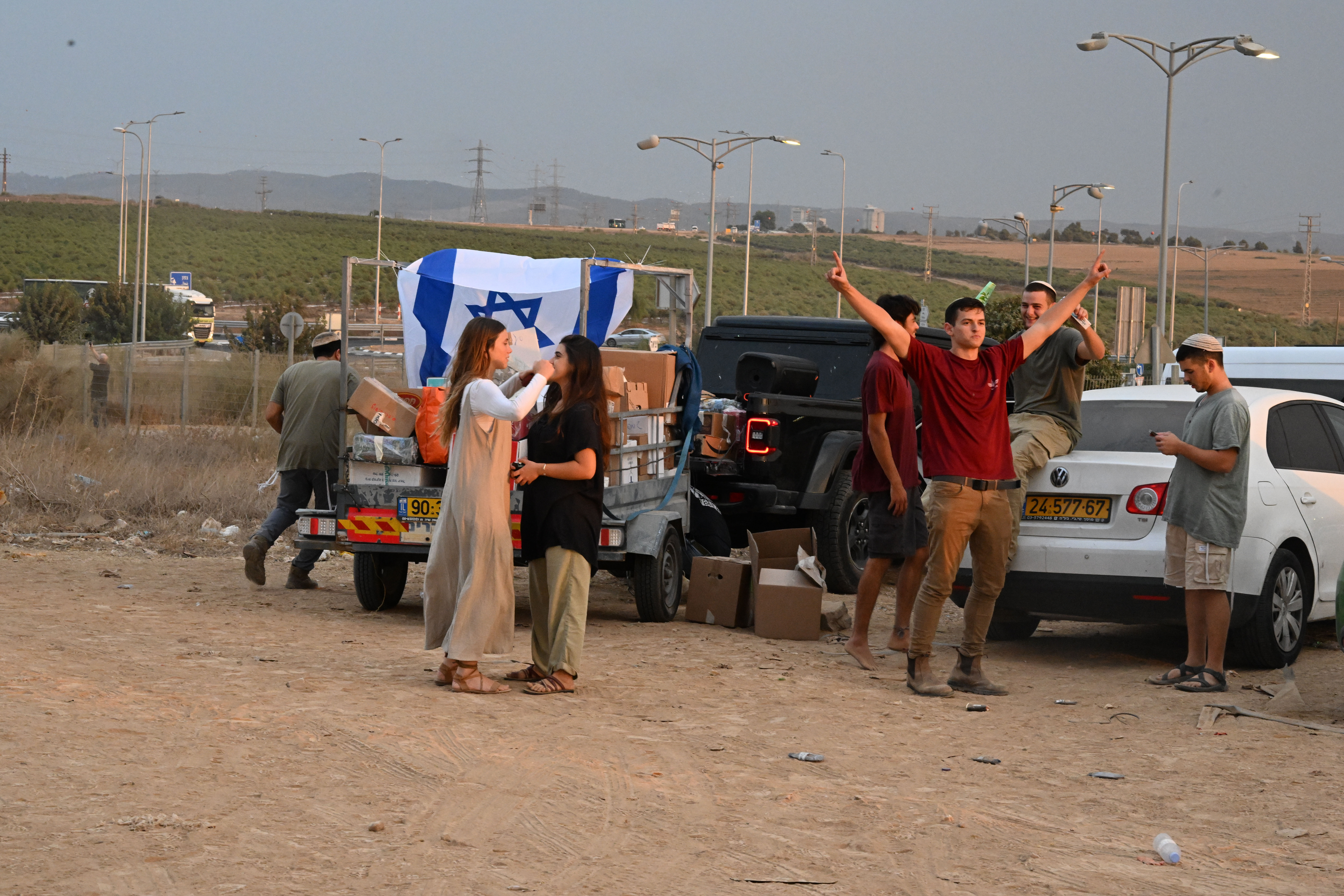At a rest stop near Hamas attack sites, Israelis rush to help families and soldiers 9 Young activists outside a gas station near Sderot, Israel, play music and pass out food to soldiers.