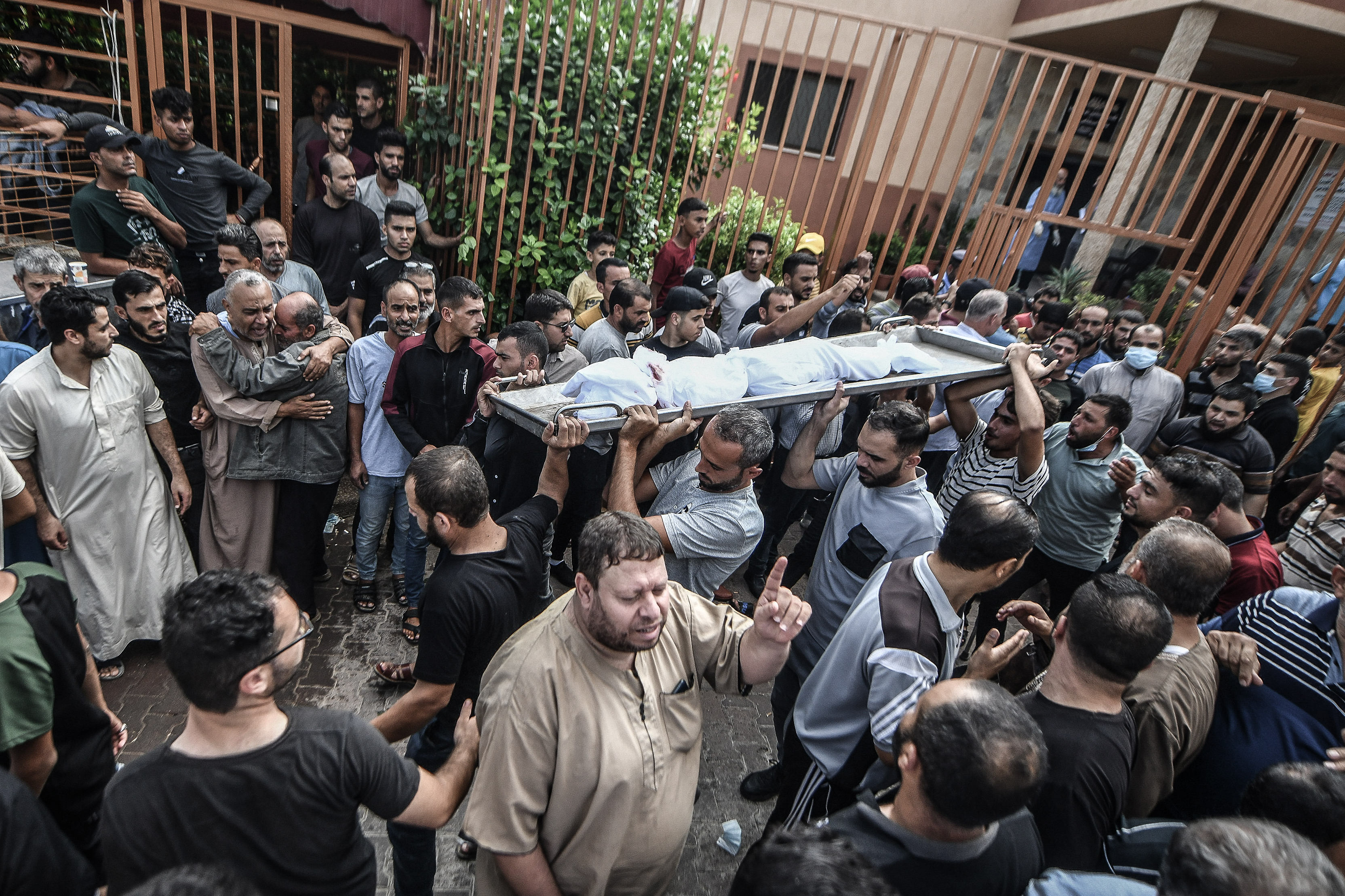 Tues., Oct. 10: Palestinians attend the funeral ceremony of Palestinian journalists Saeed Al-Taweel, Mohammad Sobh and other people including children who were killed in Israeli airstrikes, in Khan Yunis, Gaza.