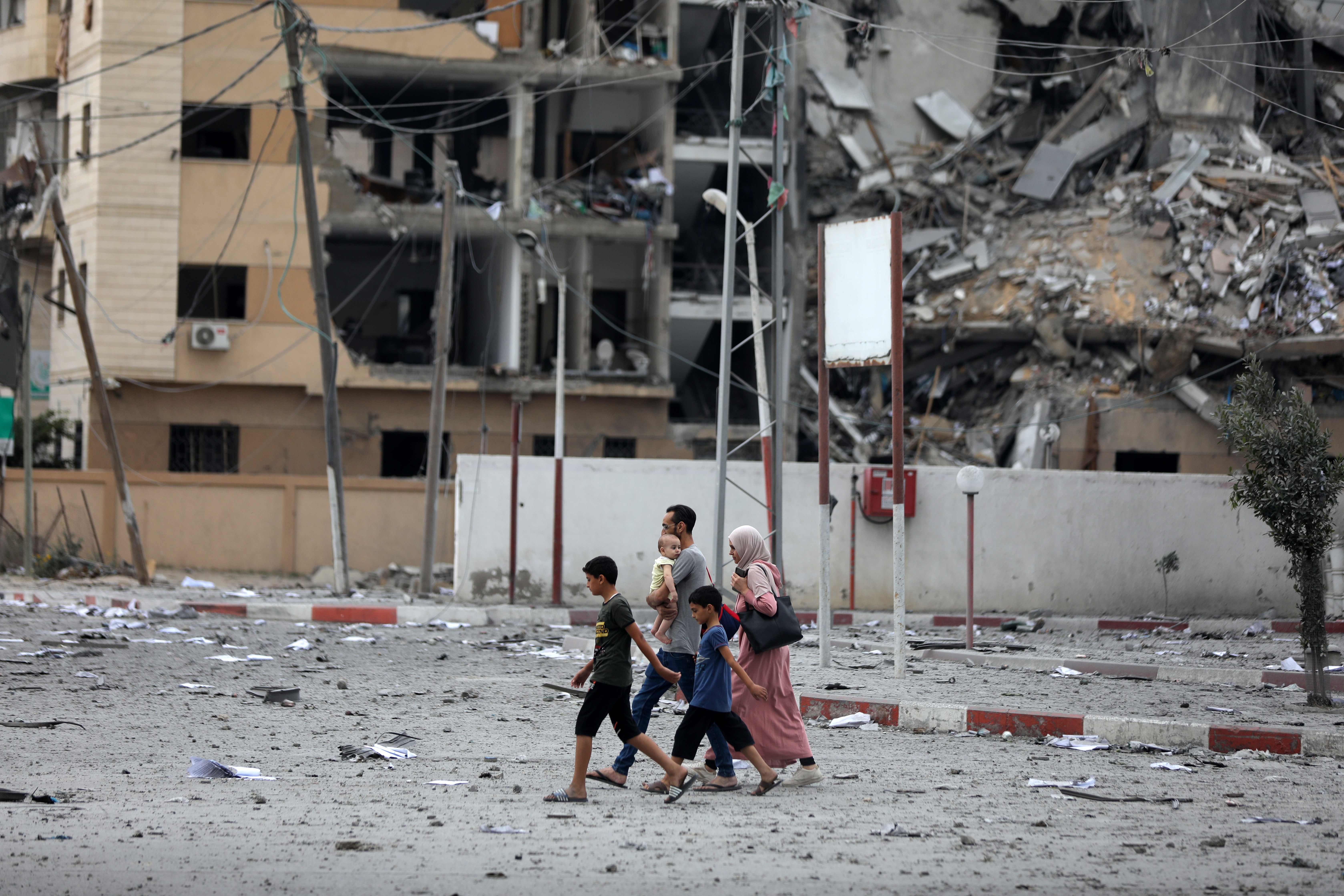 Tues., Oct. 10: Palestinians inspect the massive destruction from Israeli airstrikes in Gaza City's al-Rimal district.