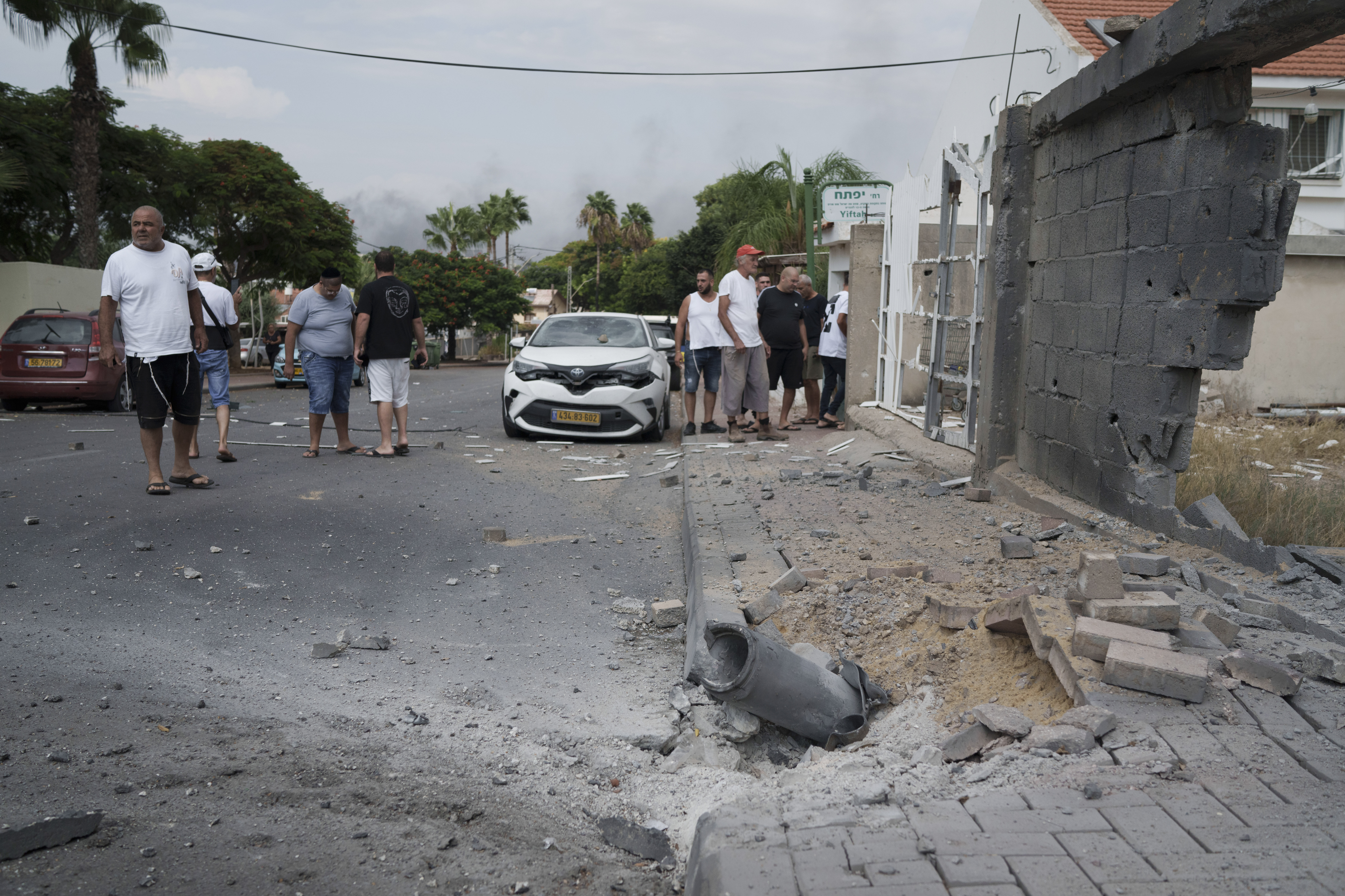 Wed., Oct. 11: Israelis look at the damage caused by rocket fire from the Gaza Strip in Ashkelon.