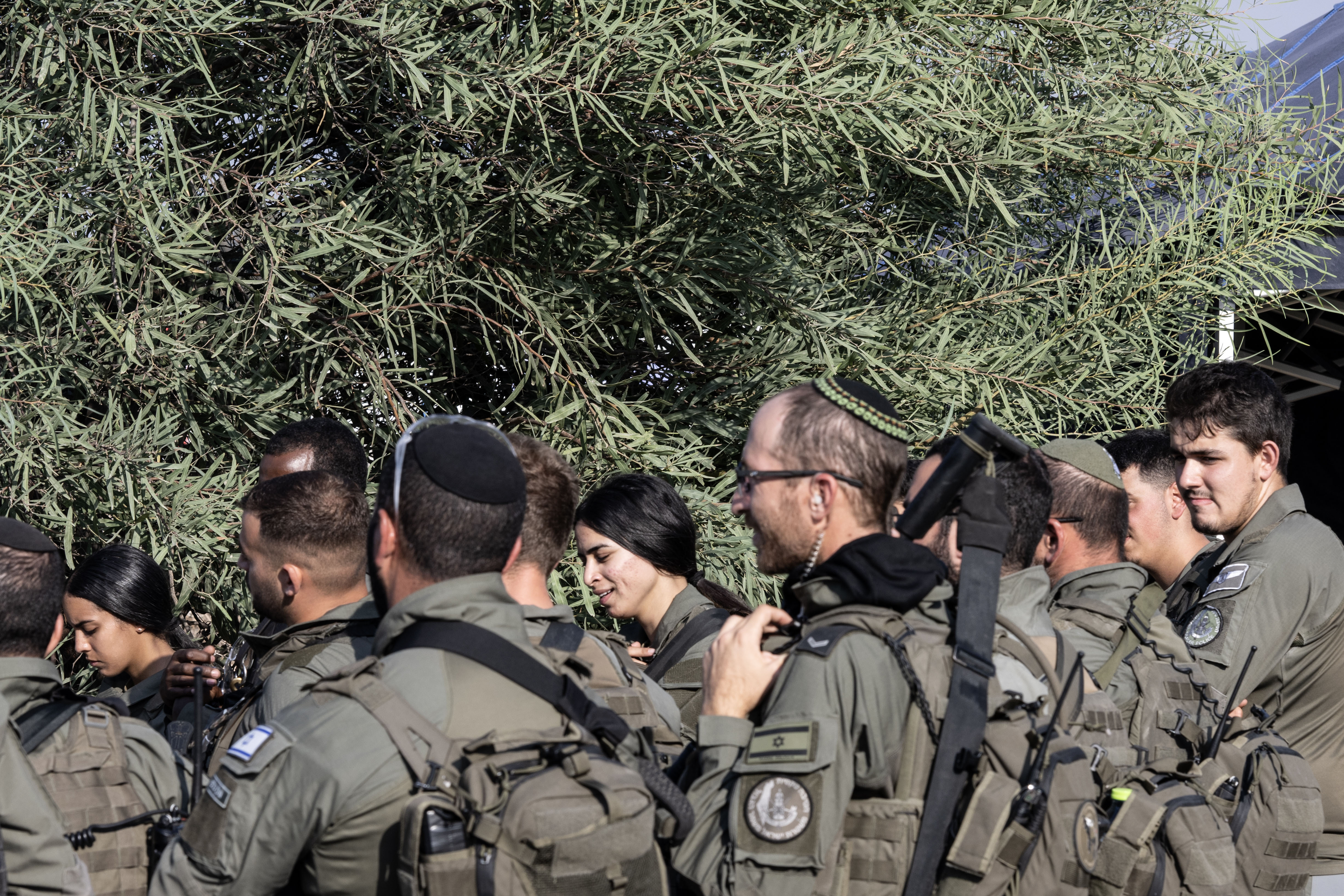 Left behind, in an assaulted Israeli town 6 Israeli border police at a staging point for medics and security forces in Sderot, Israel.