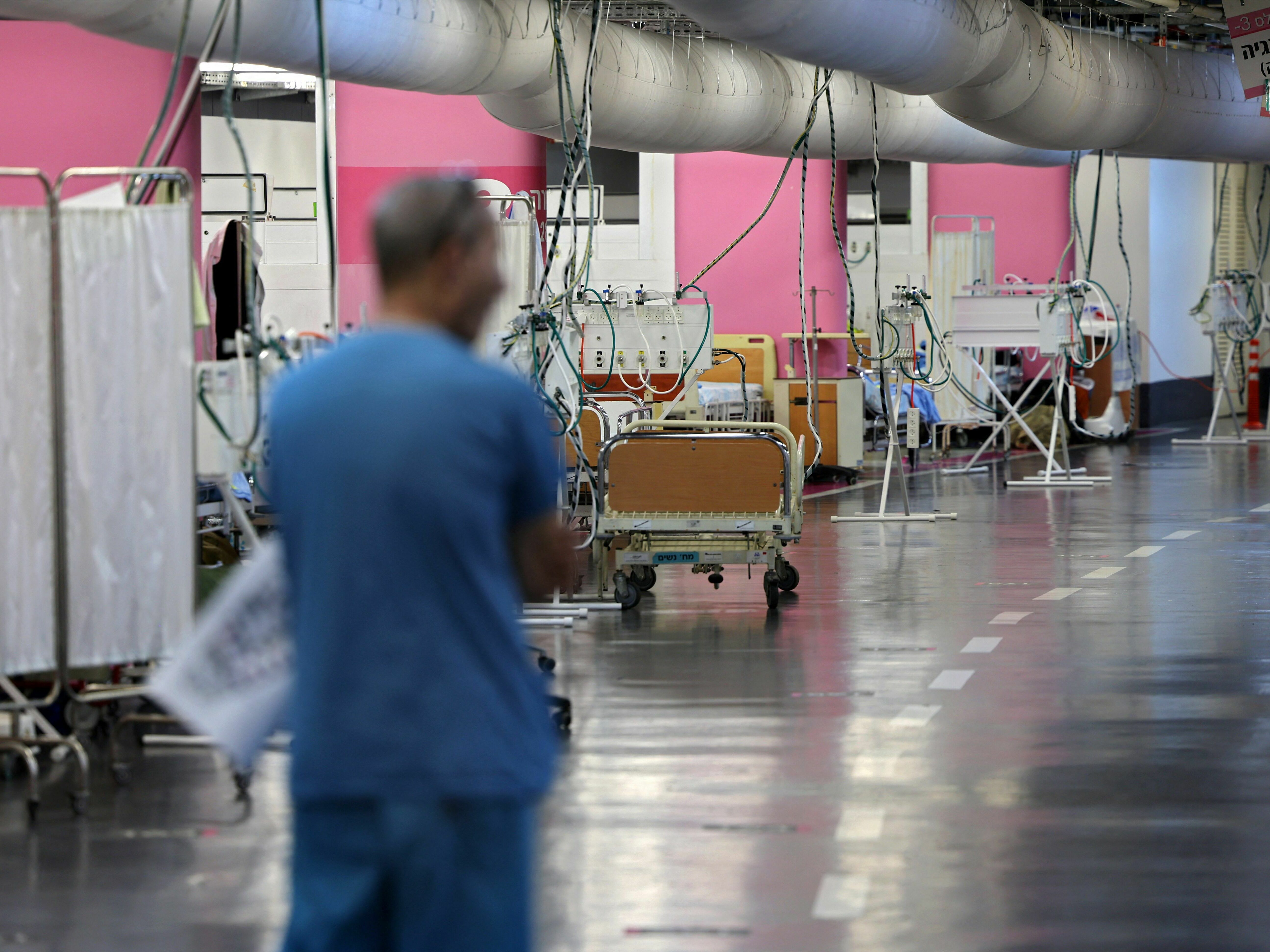 A man walks through a makeshift emergency underground hospital in the parking lot of the Rambam Health Care Campus (RHCC) in Haifa in northern Israel. (AFP via Getty Images)