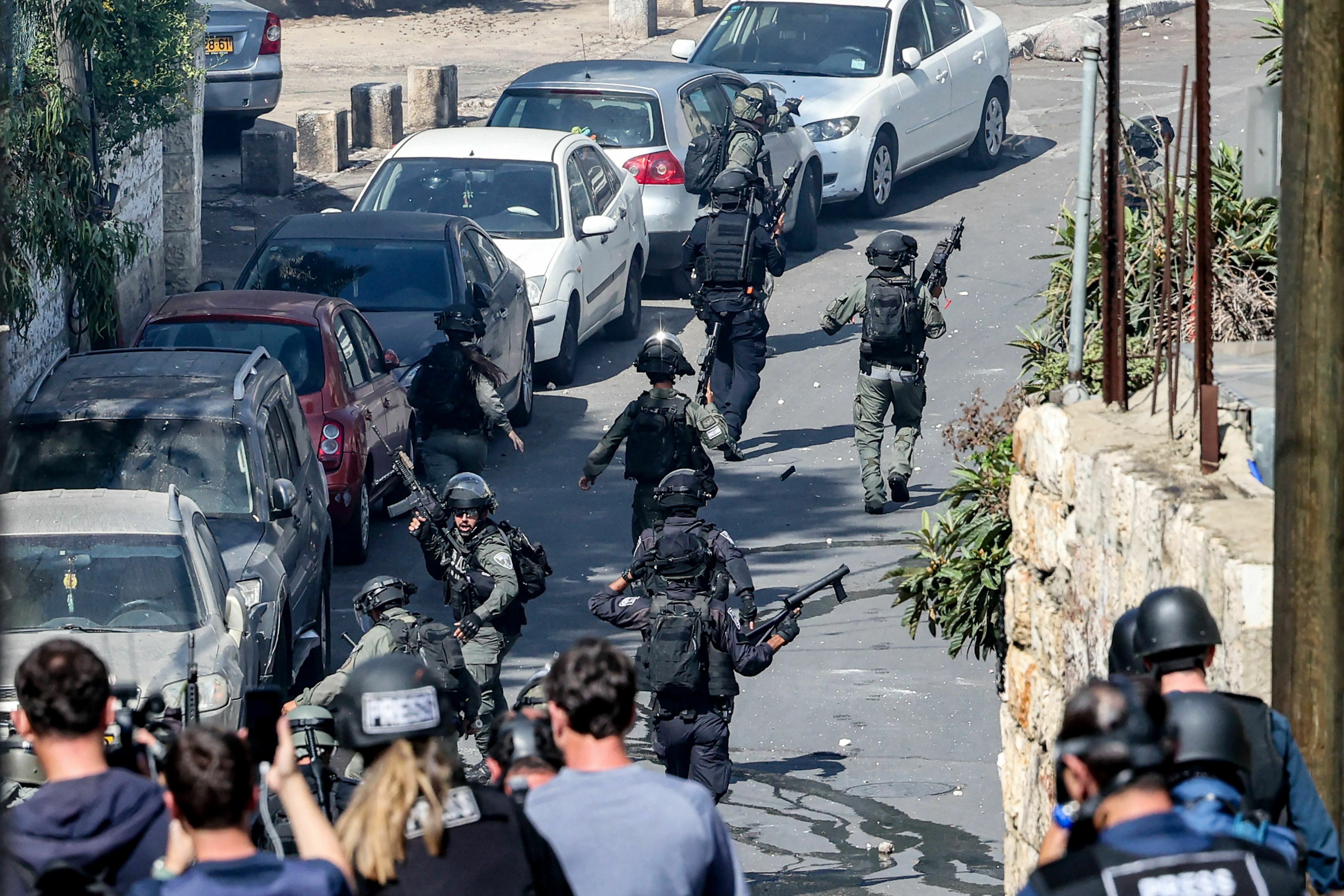 Fri., Oct. 13: Israeli security forces walk during clashes with Palestinian protesters in the Wadi Joz neighbourhood in Israeli-annexed east Jerusalem.