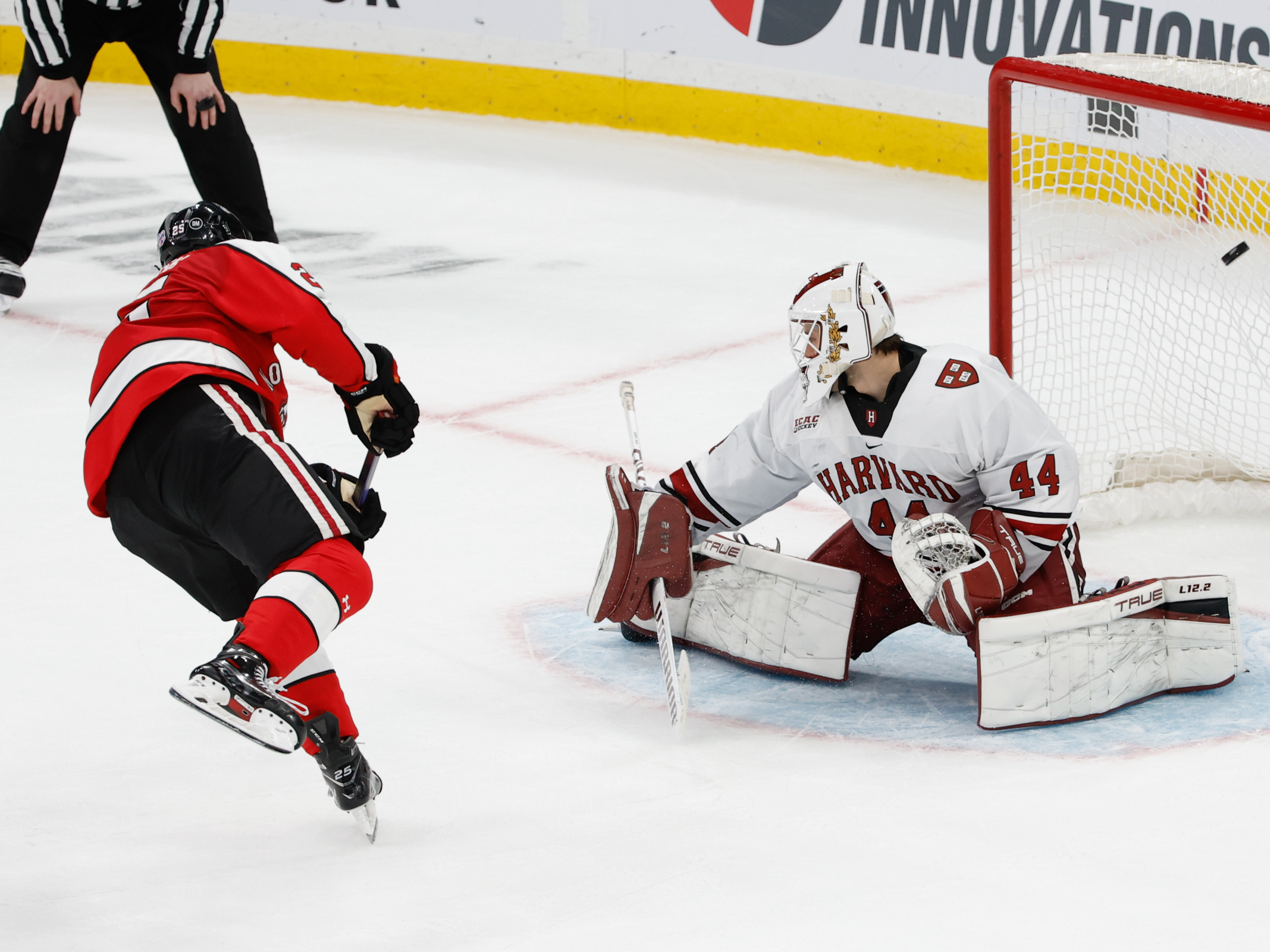 Aidan McDonough of the Northeastern Huskies scores the winning goal (3-2) against Mitchell Gibson of the Harvard Crimson in the championship game of the Beanpot Hockey Tournament on February 13, 2023 in Boston. Gibson is now trying to make it into the NHL for the Washington Capitals. (Getty Images)
