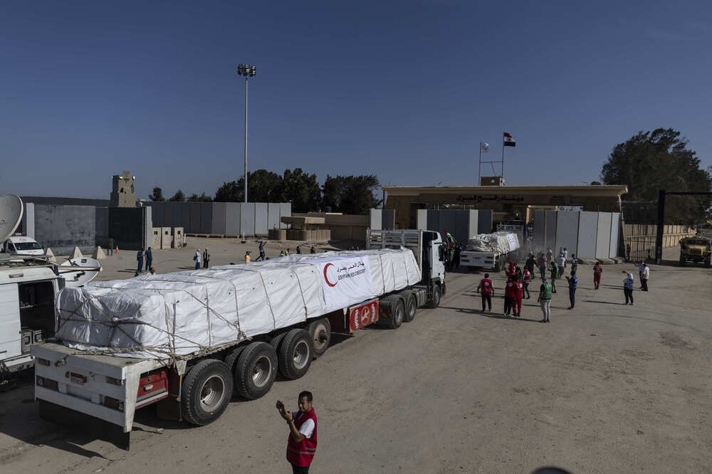 Aid convoy trucks cross the Rafah border from the Egyptian side on Saturday in North Sinai, Egypt. (Getty Images)