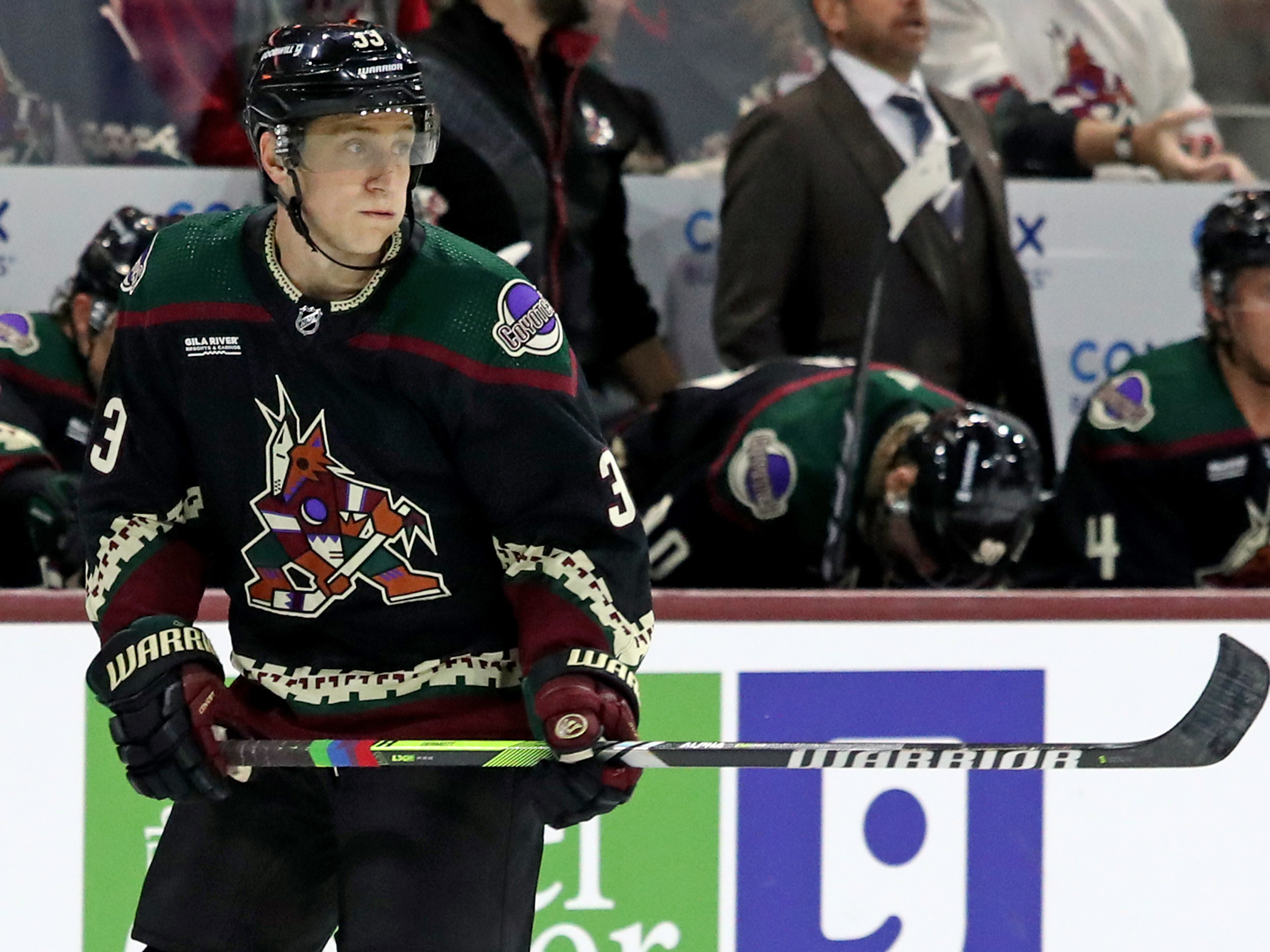 Travis Dermott of the Arizona Coyotes defied an NHL ban on Pride Tape when he used the colorful tape on his stick during his team's home opener at Mullett Arena in Tempe, Ariz. Days later, the league rescinded its ban. (Getty Images)