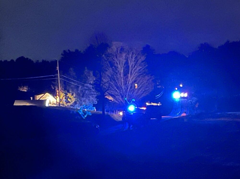 Law enforcement officials surround a house on Meadow Road in Bowdoin, Maine. (Main Public)