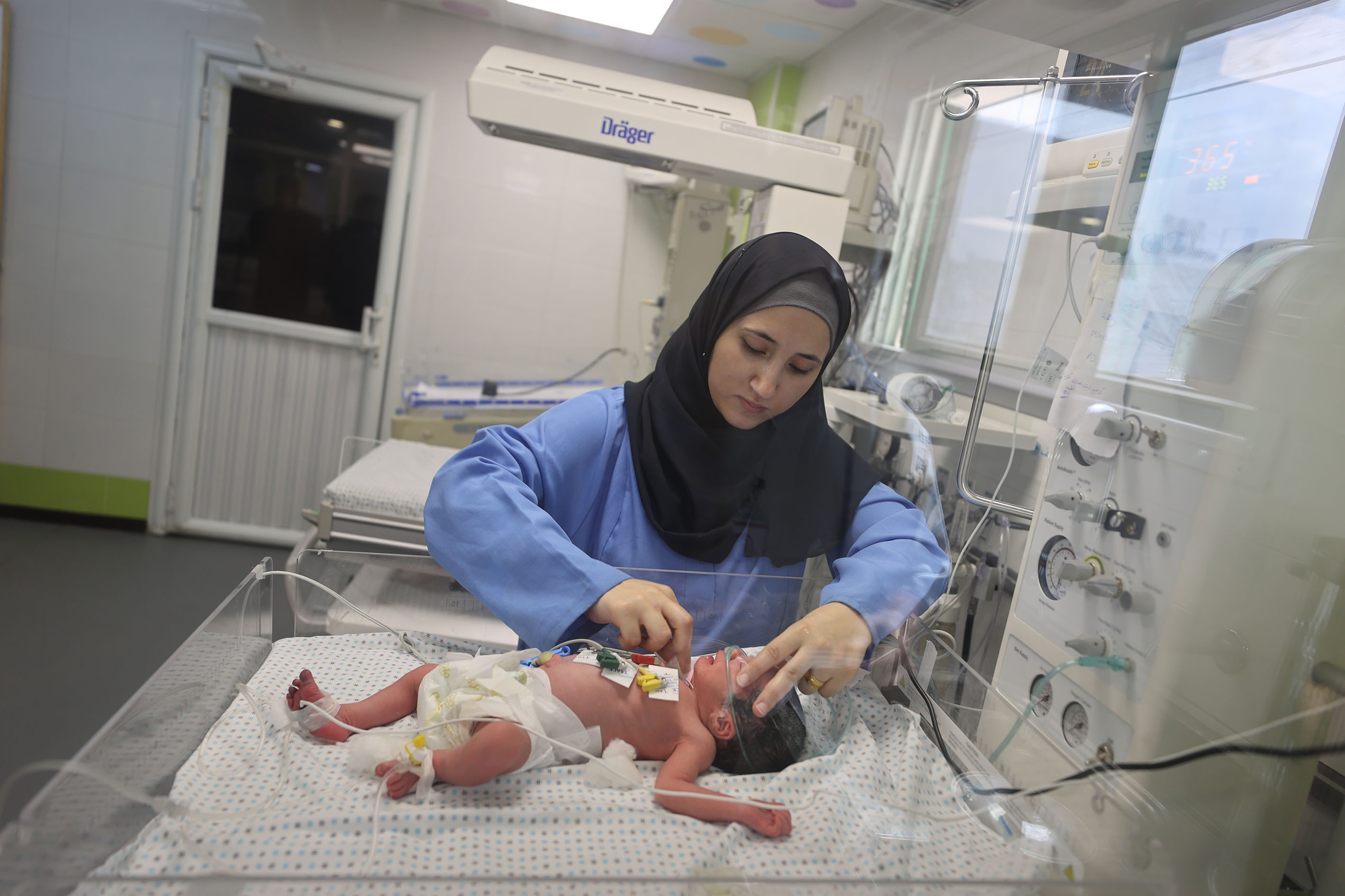 This newborn at Gaza's Nasser Hospital was delivered after their mother was killed in an Israeli airstrike on Oct. 24. The doctor said the baby is now in stable condition. (Anadolu via Getty Images)