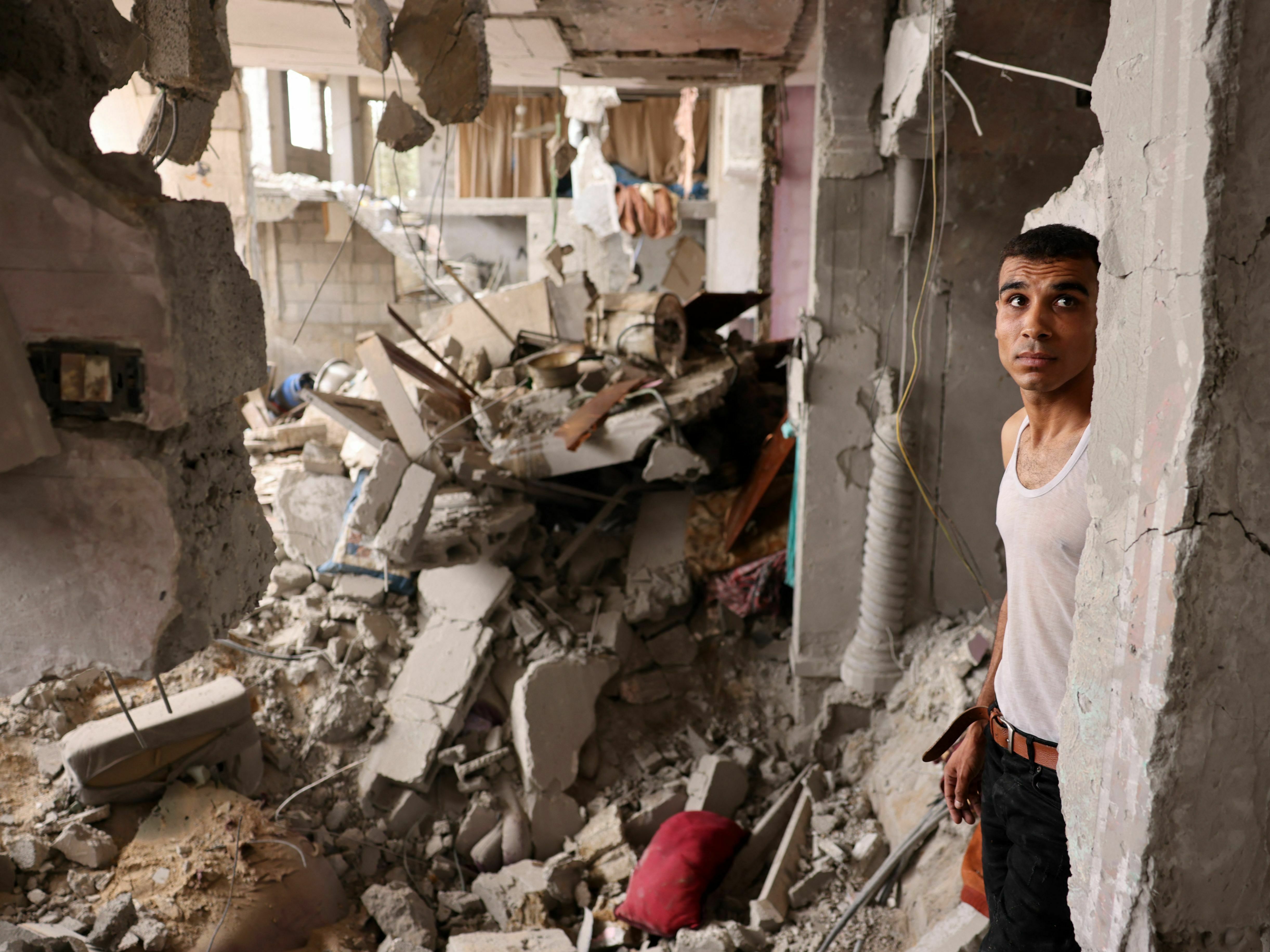 A man stands amid the rubble of a building in the aftermath of Israeli bombing in Rafah in the southern Gaza Strip on Sunday. (AFP via Getty Images)
