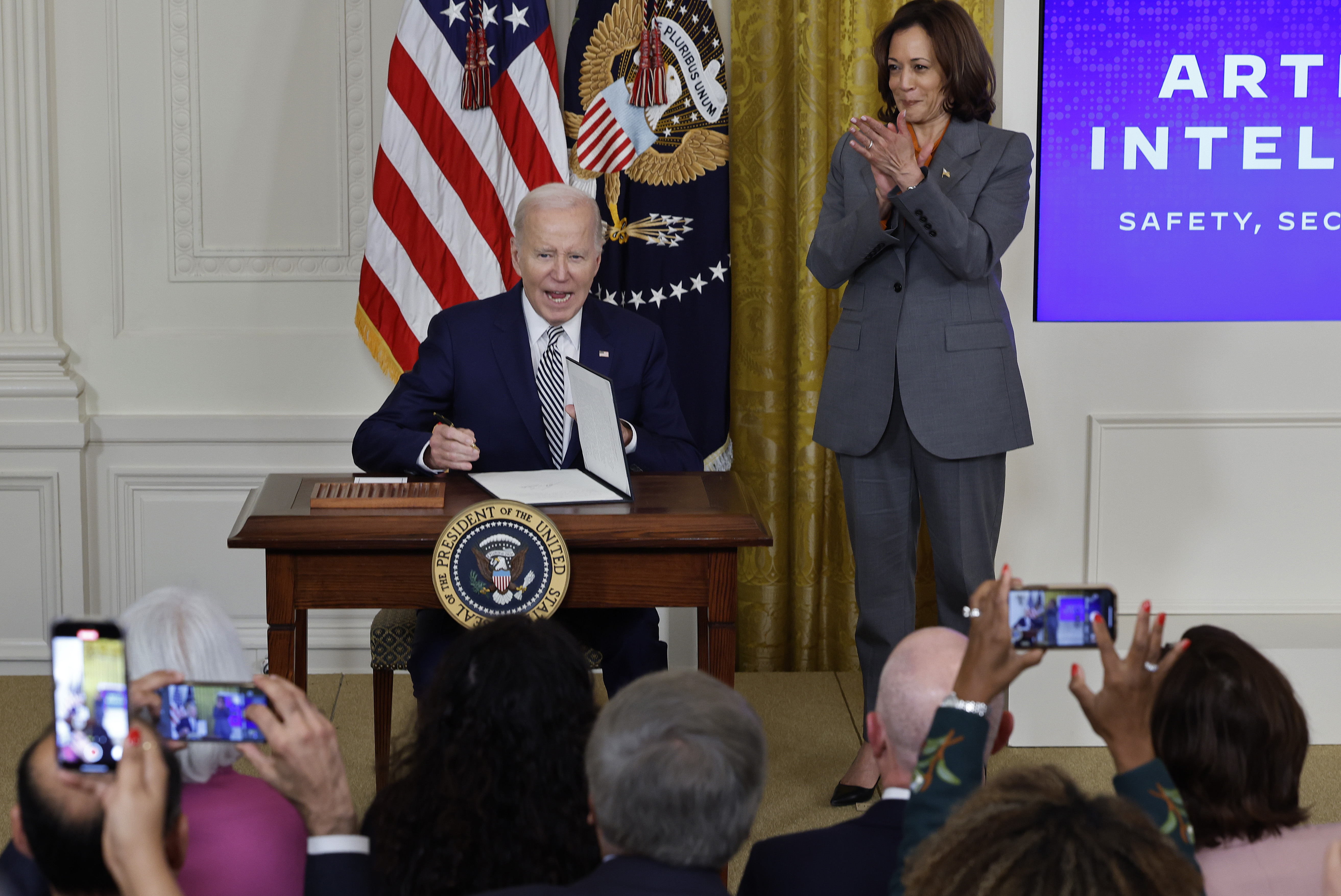 President Biden signs a new executive order on artificial intelligence on Oct. 30. Vice President Harris will talk about the order in London with world leaders this week. (Getty Images)