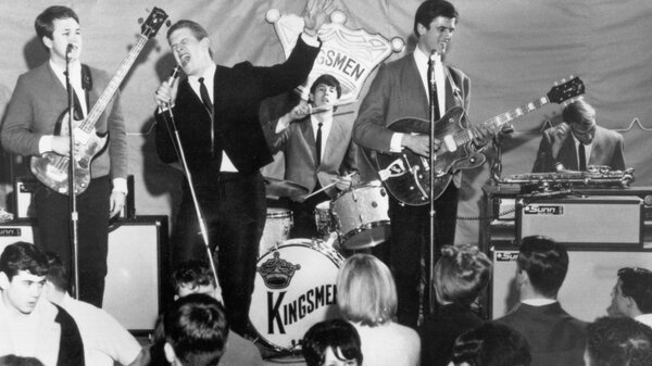 Norm Sundholm, Lynn Easton, Dick Peterson, Mike Mitchell and Barry Curtis of the touring version of the rock and roll band "The Kingsmen" performing onstage in 1964.