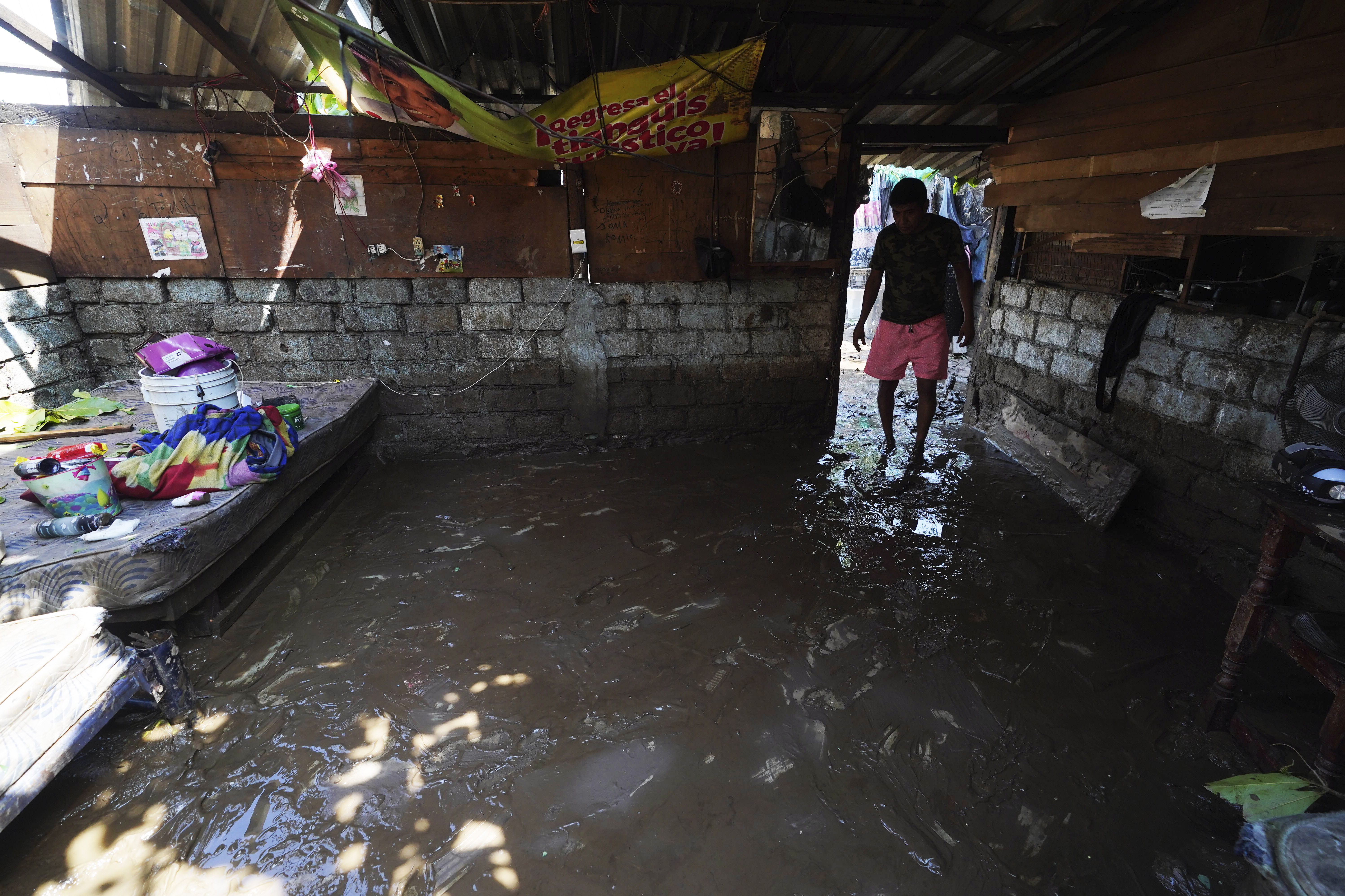 Oct. 26: Miguel Cantu shows the destruction of his home and belongings, in the wake of Hurricane Otis in Acapulco, Mexico.