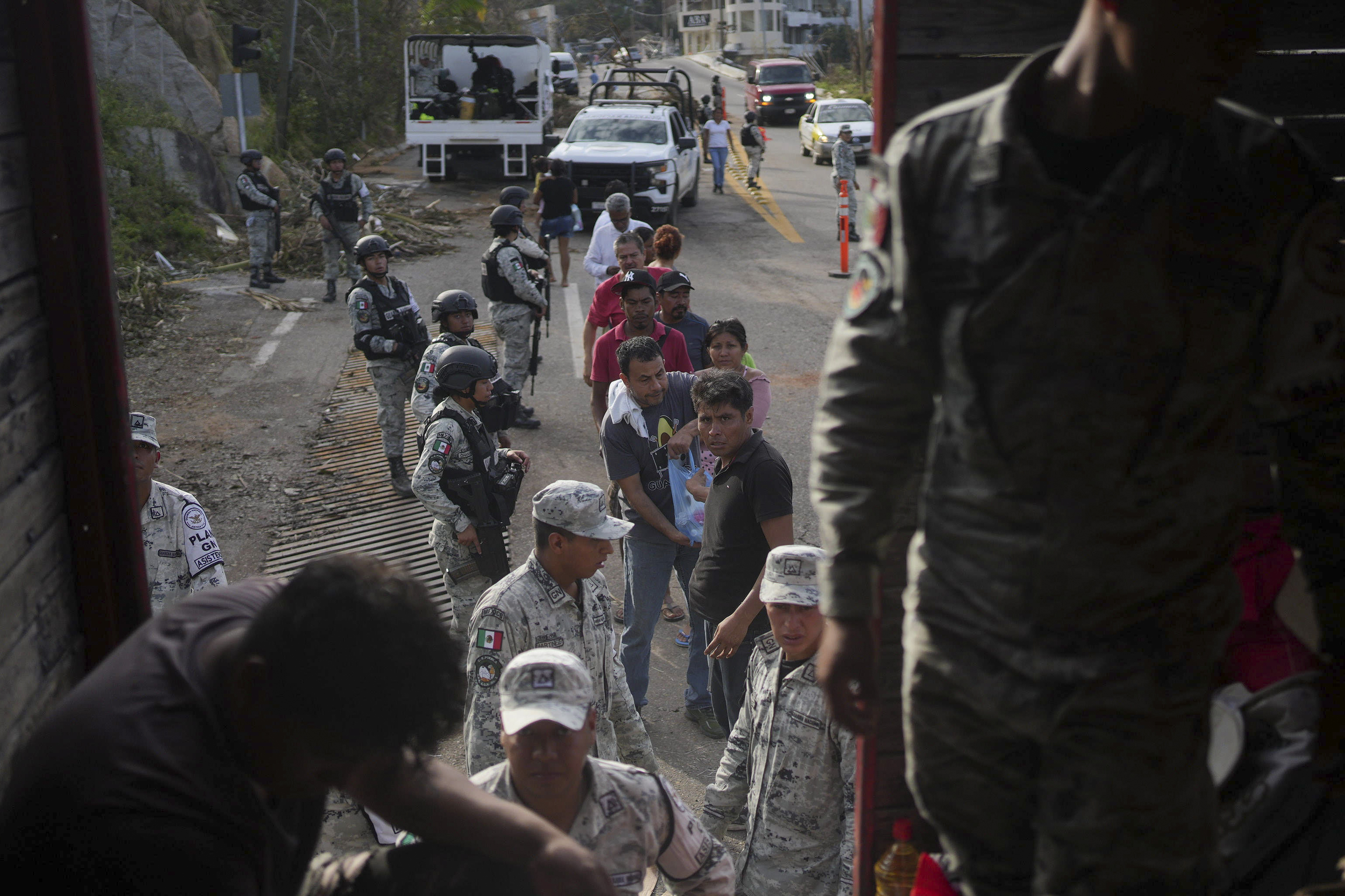 Oct. 28: Soldiers stand guard during a food delivery, in the aftermath of Hurricane Otis in Acapulco, Mexico.