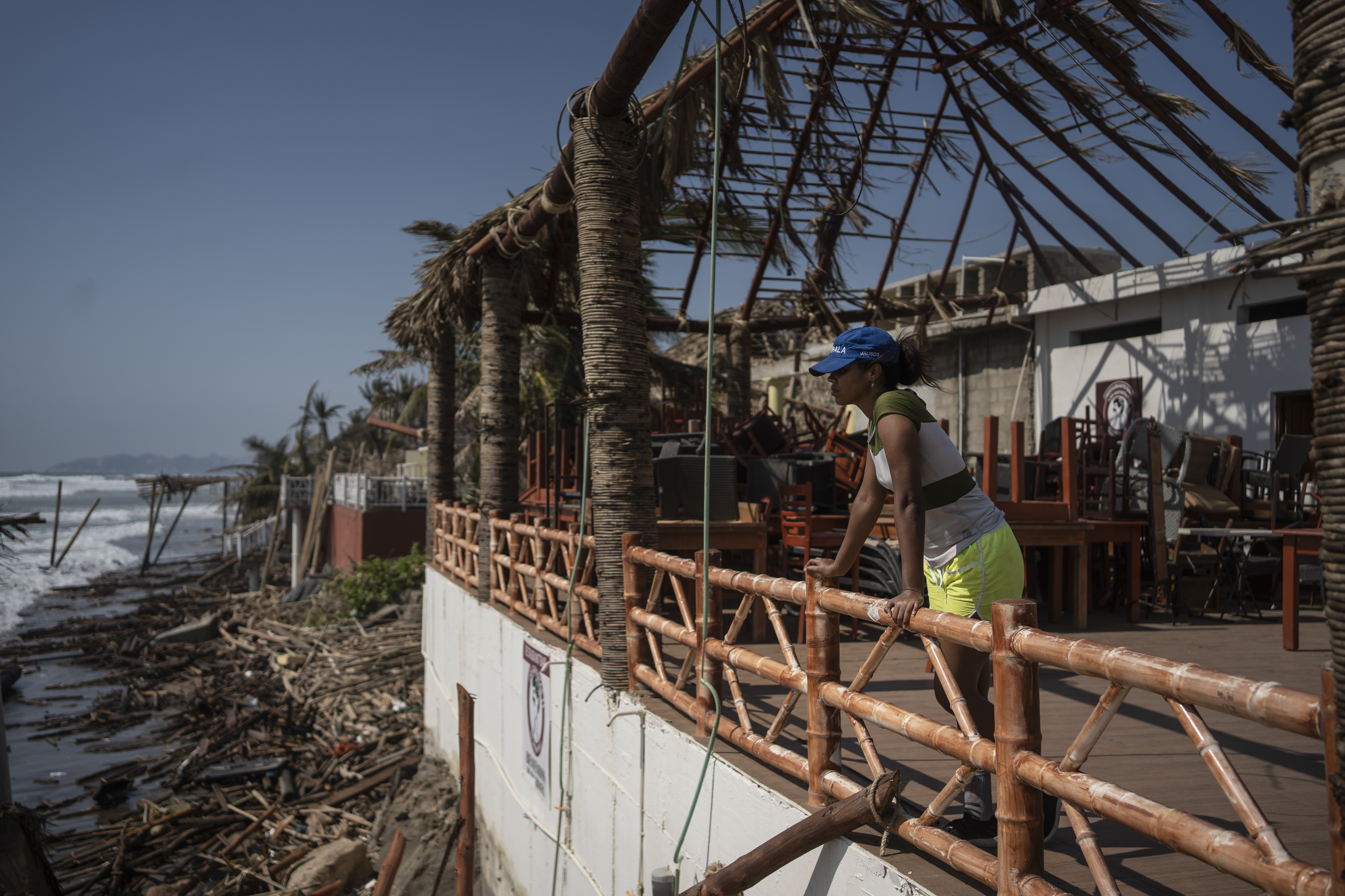 Oct. 29: A woman stands at a damaged area in the aftermath of Hurricane Otis in Acapulco, Mexico.