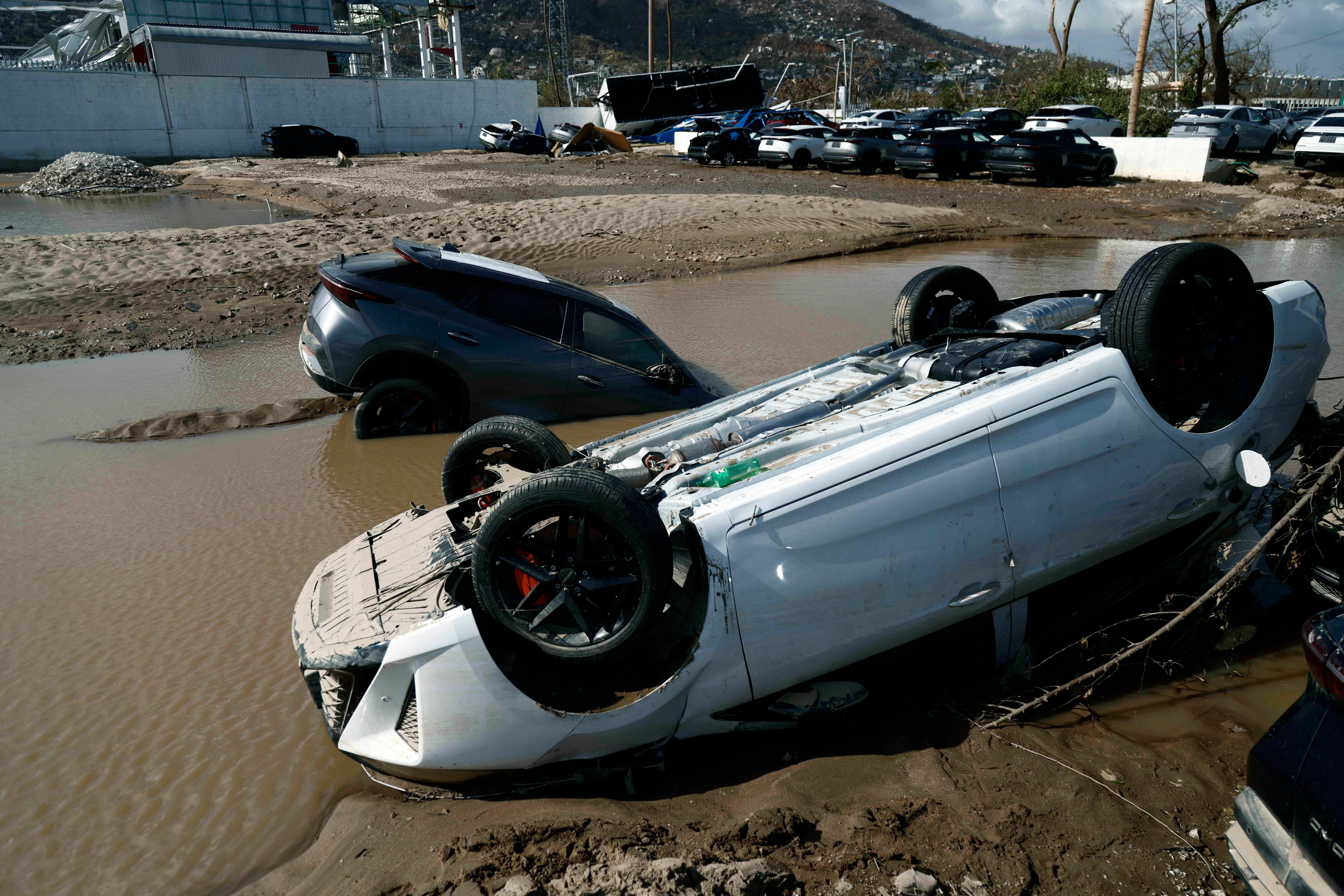 Oct. 27: Cars lay partially under water in the aftermath of hurricane Otis at "Zona Diamante" in Acapulco, Guerrero State, Mexico.
