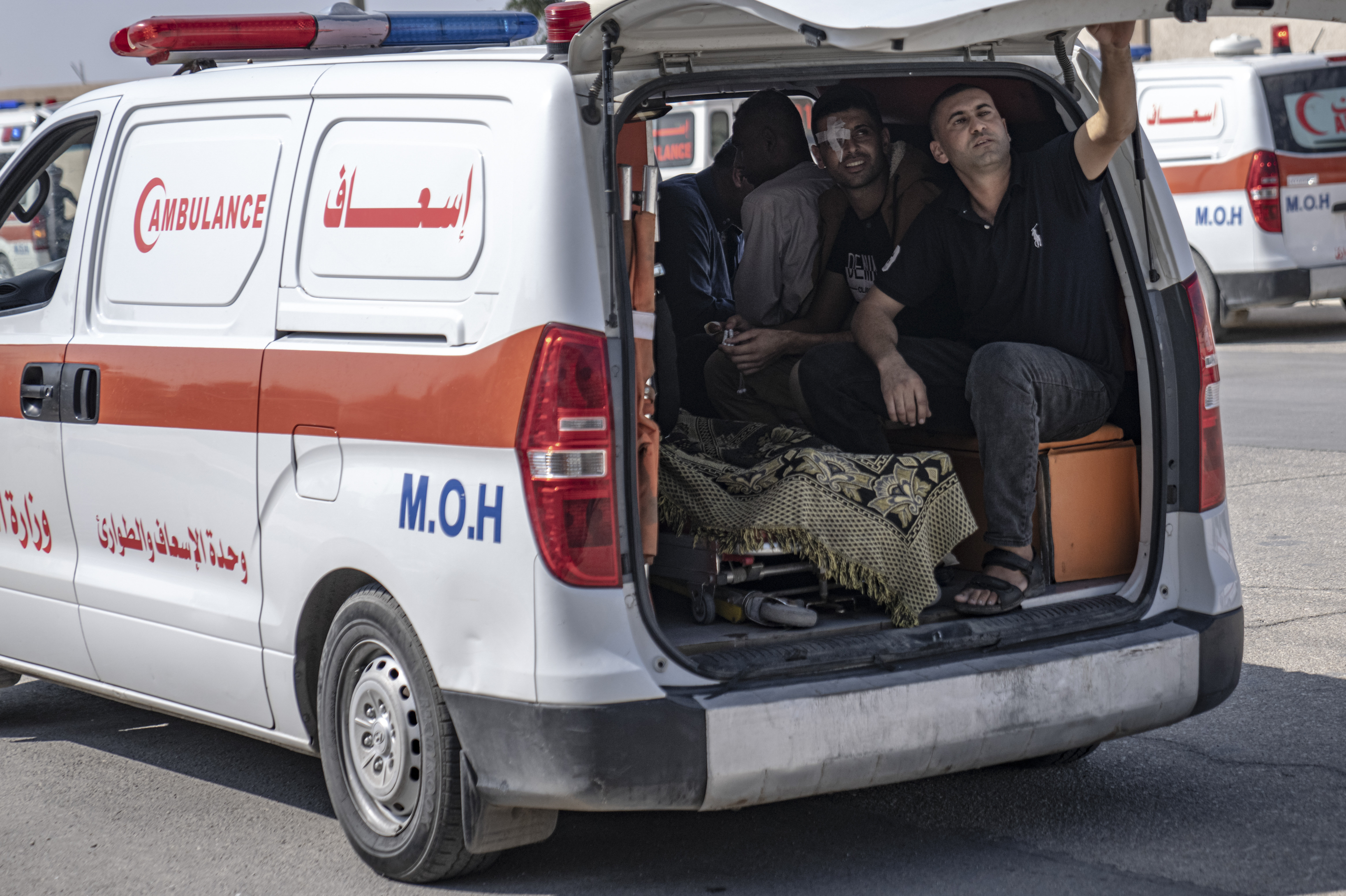 Ambulances with Palestinians wounded in the Israeli bombardment of the Gaza Strip arrive at Rafah border crossing to Egypt.