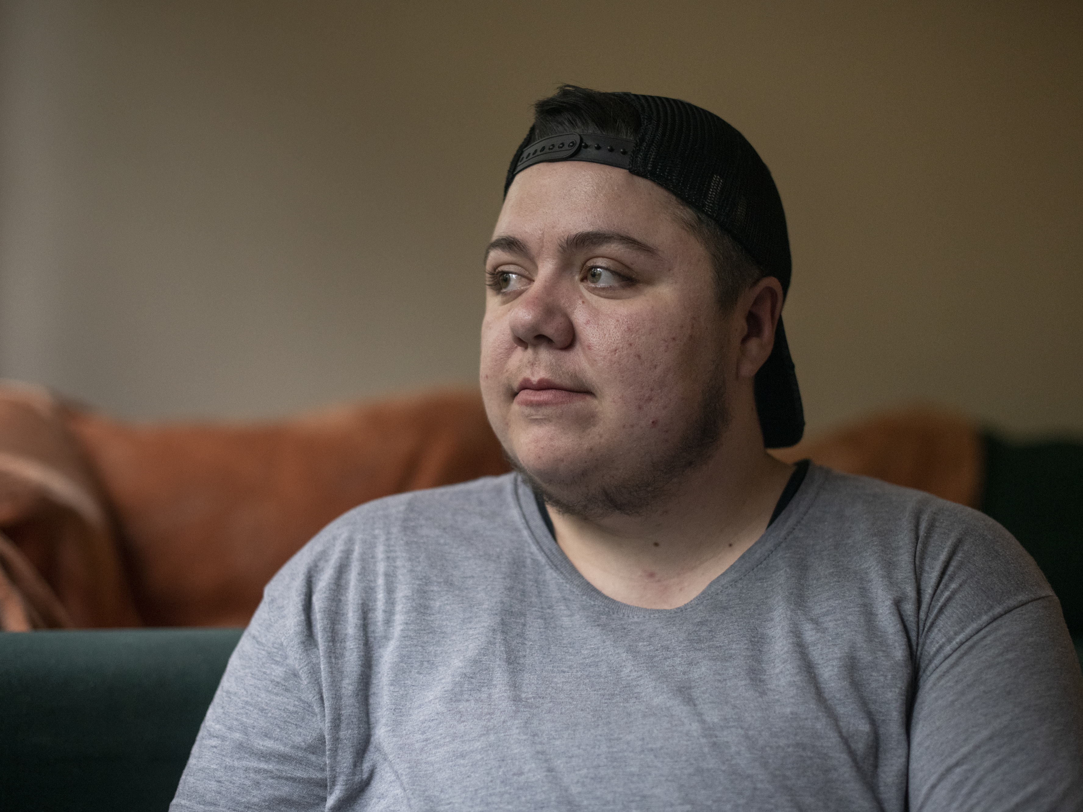 Kayce Atencio, who has been shadowed by medical debt for most of his adult life, had been unable to rent an apartment because of poor credit due to medical debt, he said. Recent reporting changes by credit rating agencies have removed many debts from consumer credit reports and lifted scores for millions, a new study finds. (Rachel Woolf for KFF Health News)