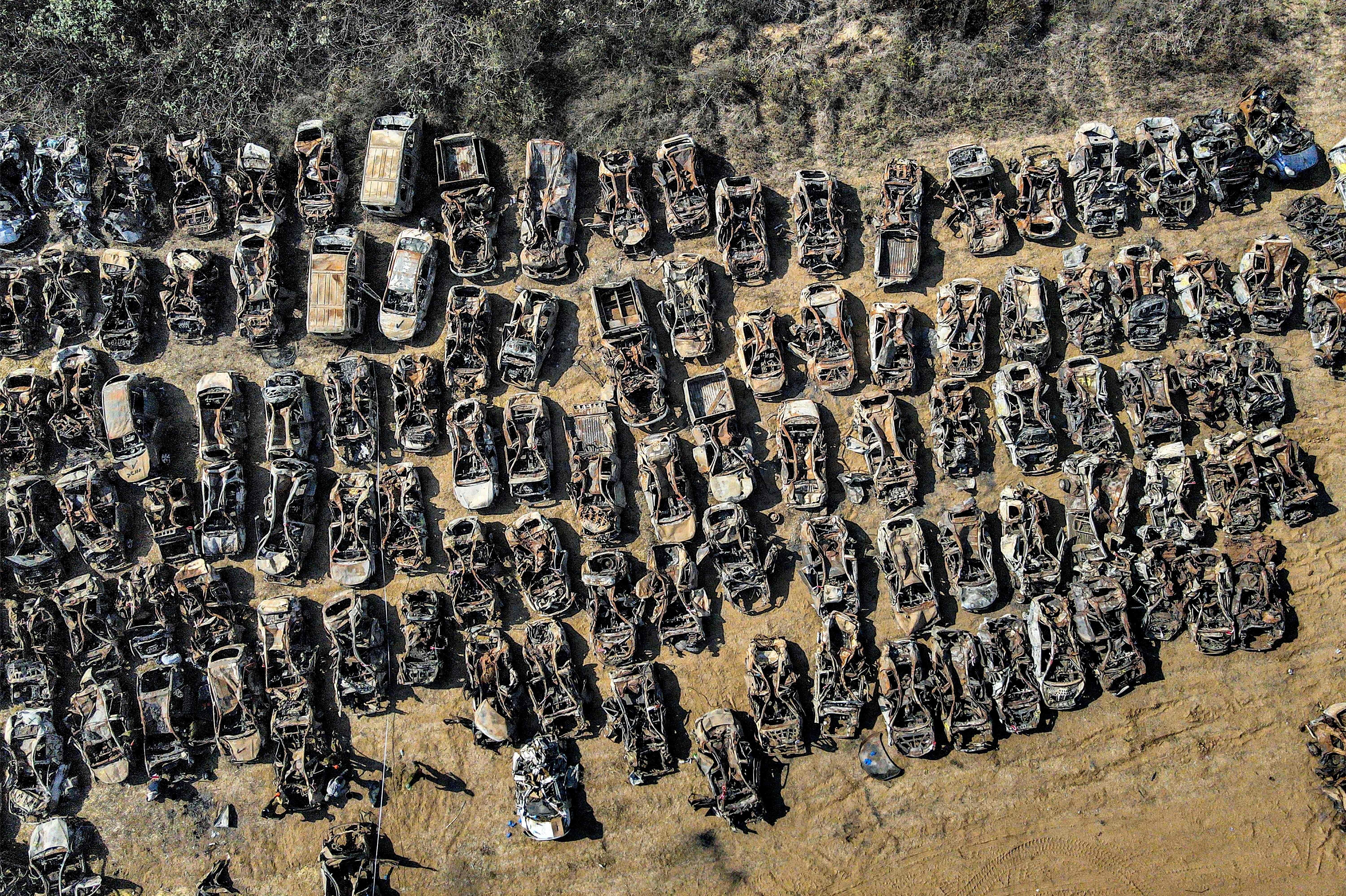 This aerial view shows some of the hundreds of burned vehicles that were destroyed in the Oct. 7 attack carried out by Palestinian militants from the Gaza Strip, after they have been collected from that area and transported outside the city of Netivot in southern Israel on Wednesday.