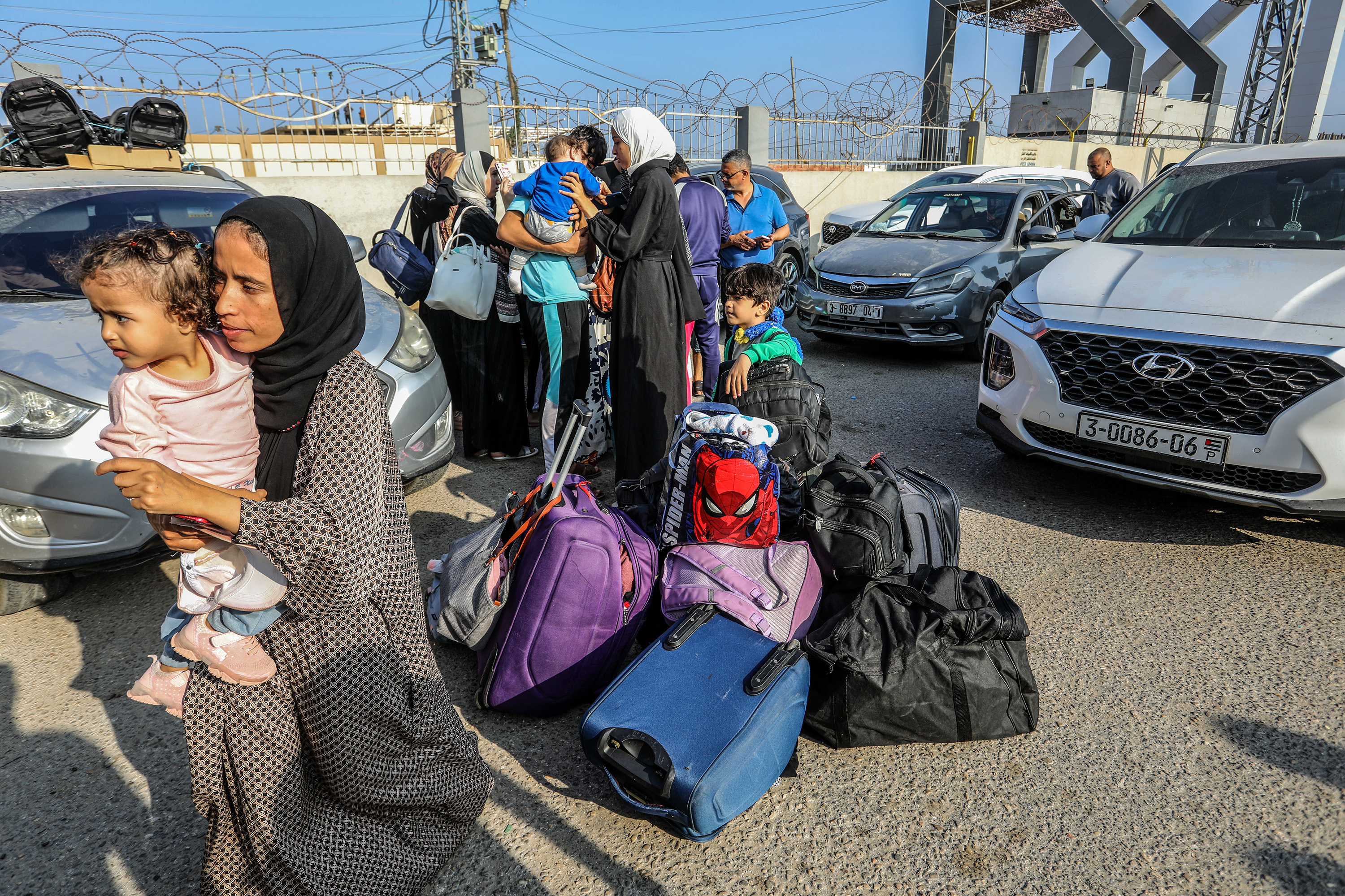 Palestinians with foreign passports at Rafah Border Gate wait to cross into Egypt, Nov. 1. (Abed Rahim Khatib/Anadolu via Getty Images)