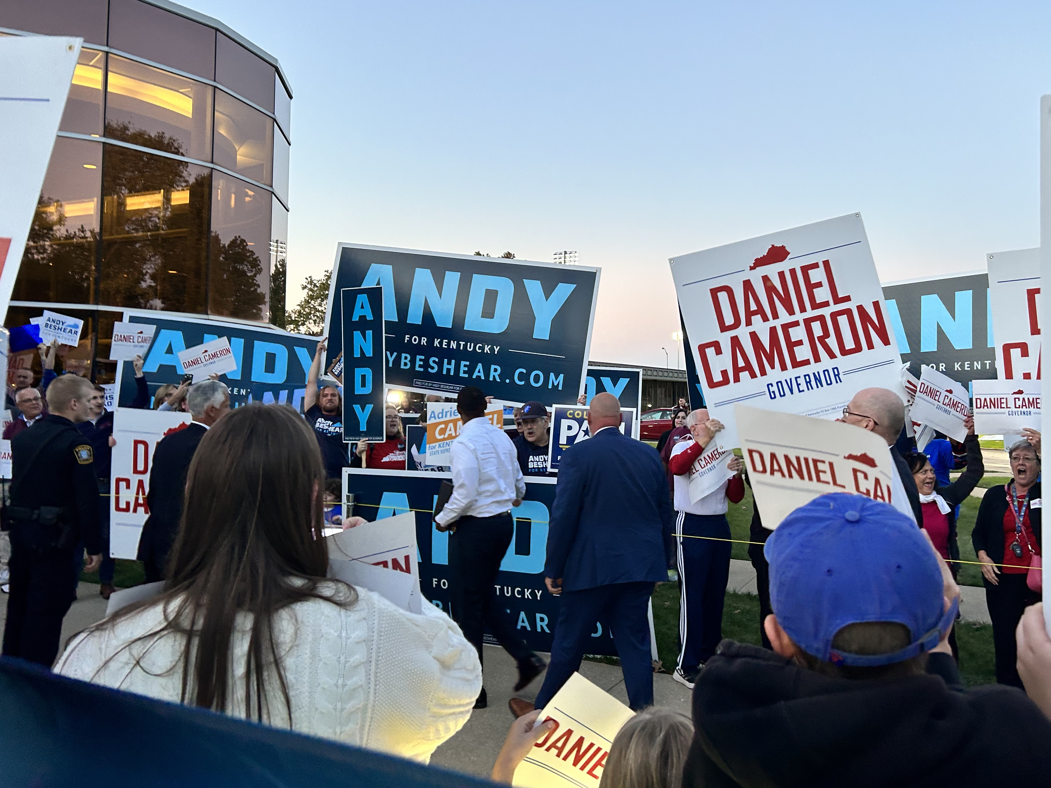 Candidates and supporters of Andy Beshear and Daniel Cameron gather ahead of a gubernatorial debate in October. (Kentucky Public Radio)