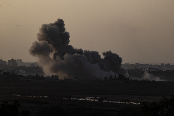 Smoke rises in the Gaza Strip, which is seen from the city of Sderot, Israel, as Israeli airstrikes continue on Tuesday.