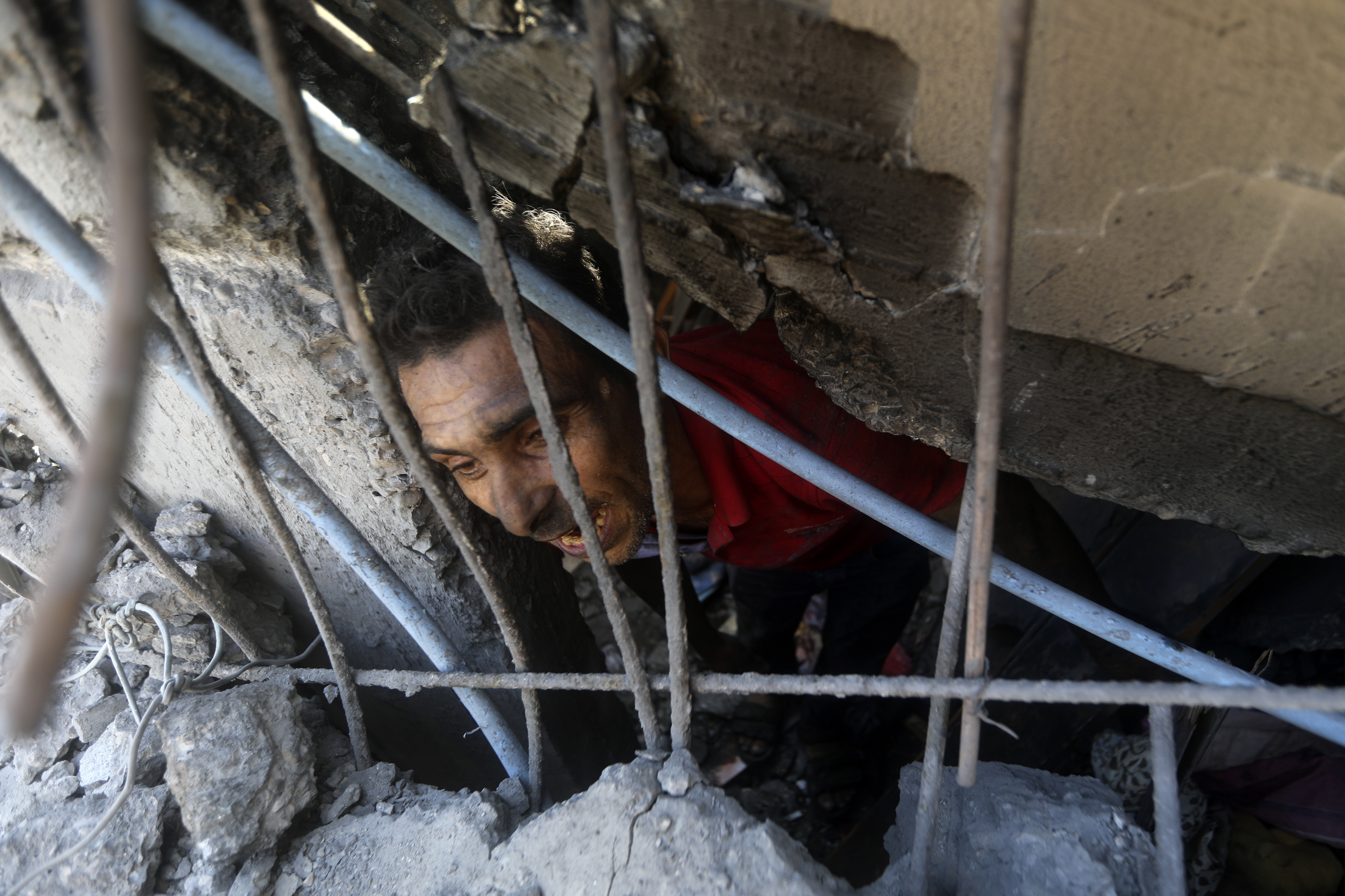 Mon., Nov. 6: Palestinians look for survivors under the rubble of a destroyed building following an Israeli airstrike in Khan Younis refugee camp, southern Gaza Strip.