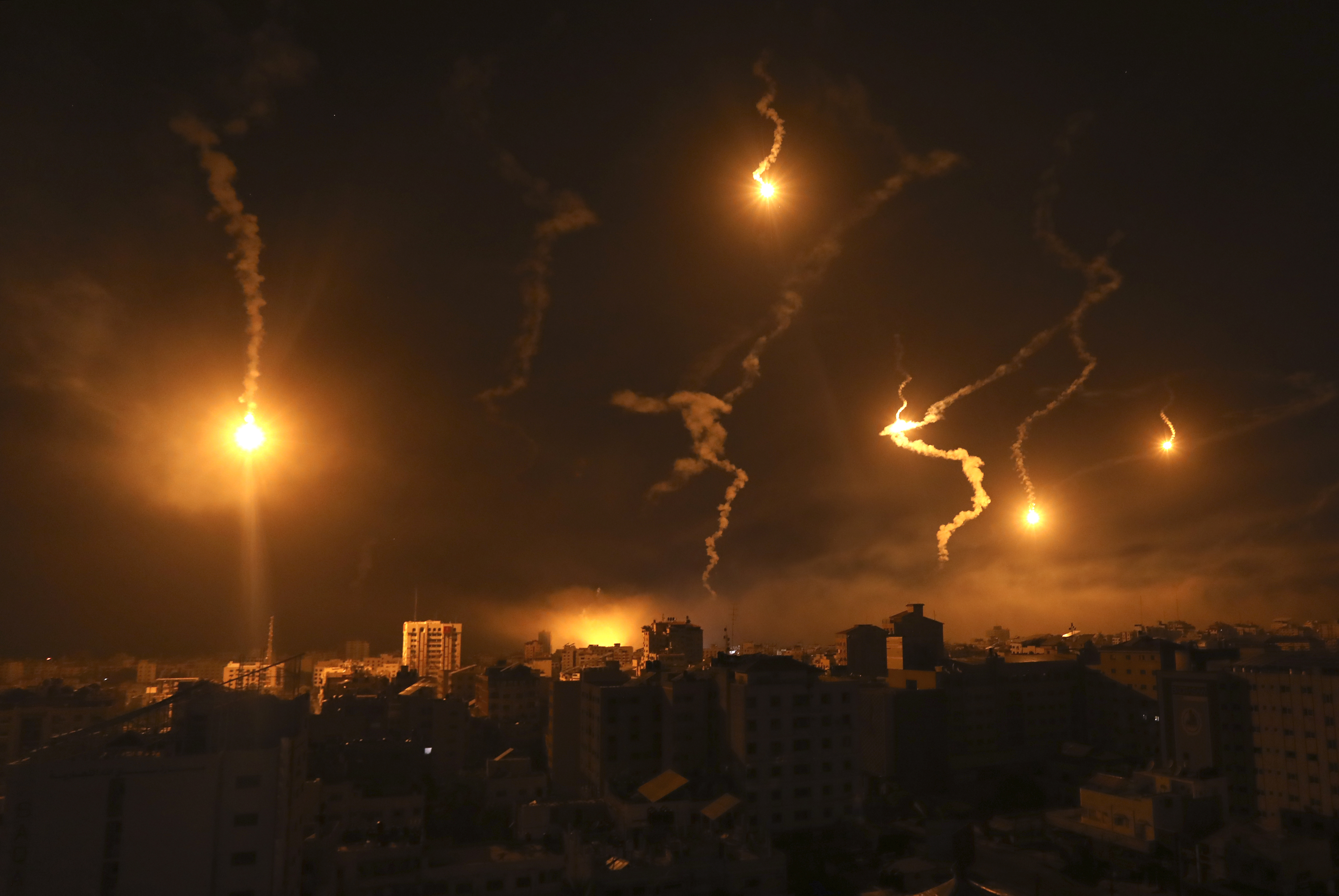 Mon., Nov. 6: Flares fired by Israeli forces light up the night sky in Gaza City.
