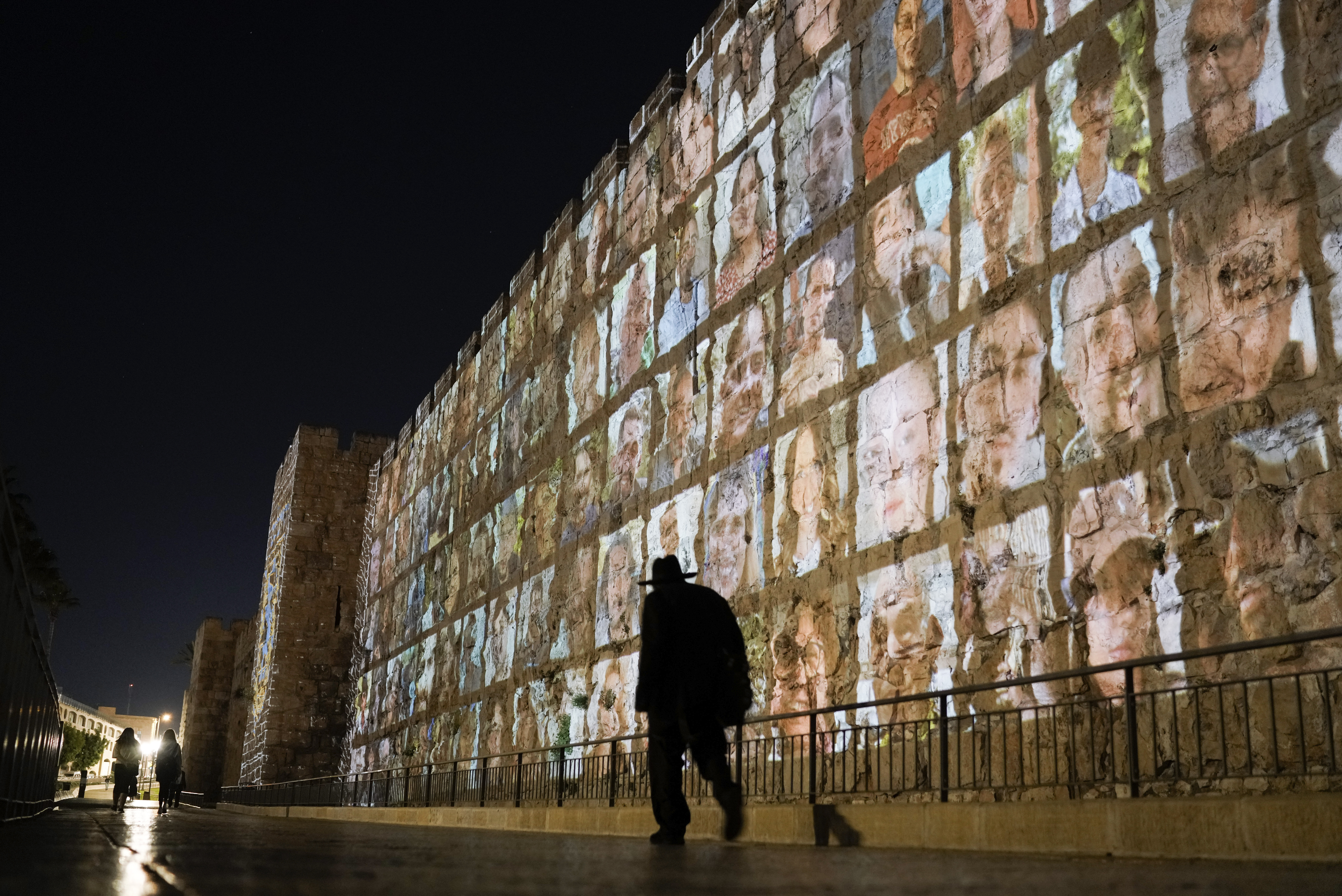 Mon., Nov. 6: Photographs of Israeli hostages being held by Hamas militants are projected on the walls of Jerusalem's Old City.