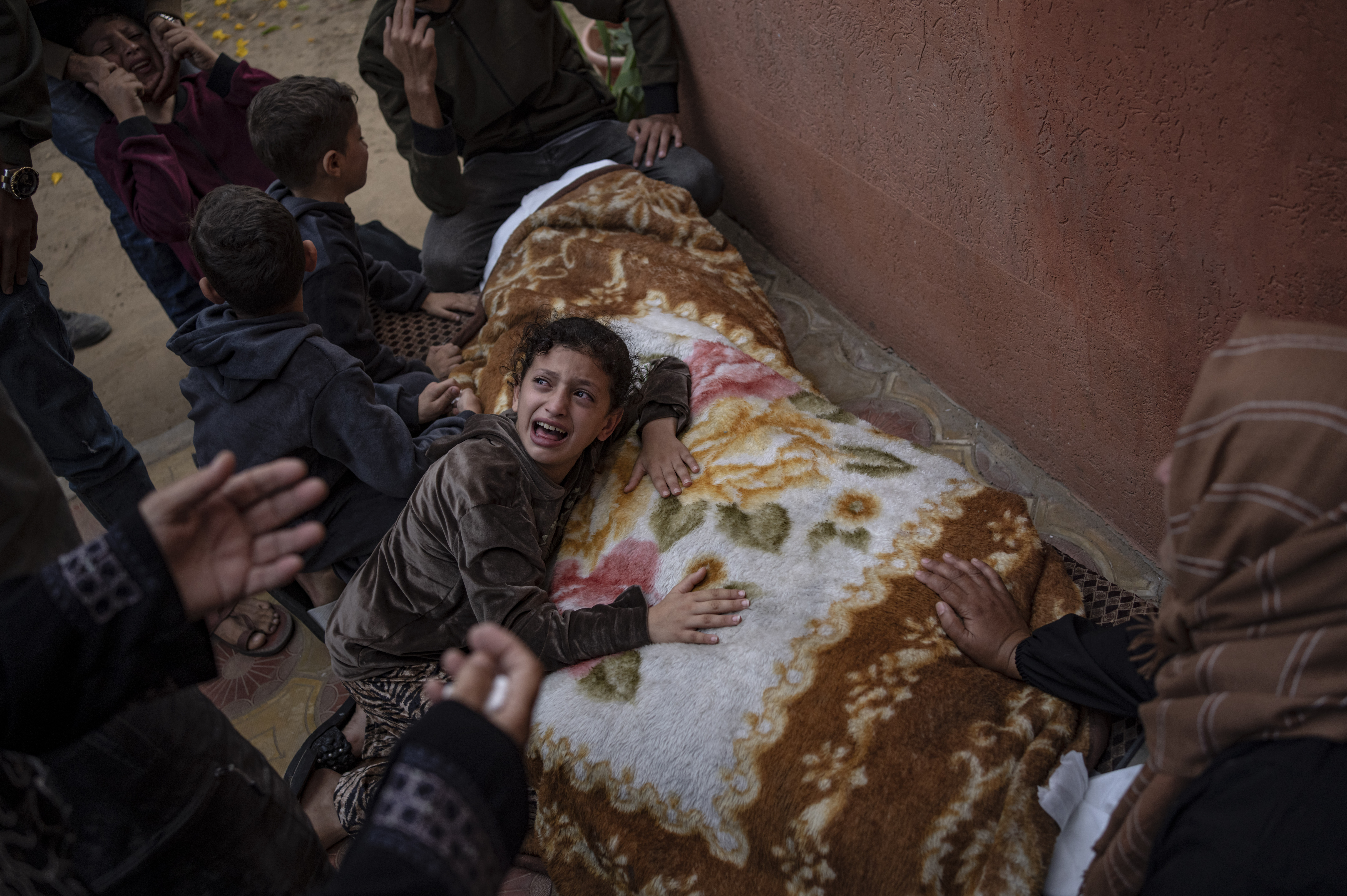Sat., Nov. 11: Palestinians mourn their relatives killed in the Israeli bombardment of the Gaza Strip, in the hospital in Khan Younis.