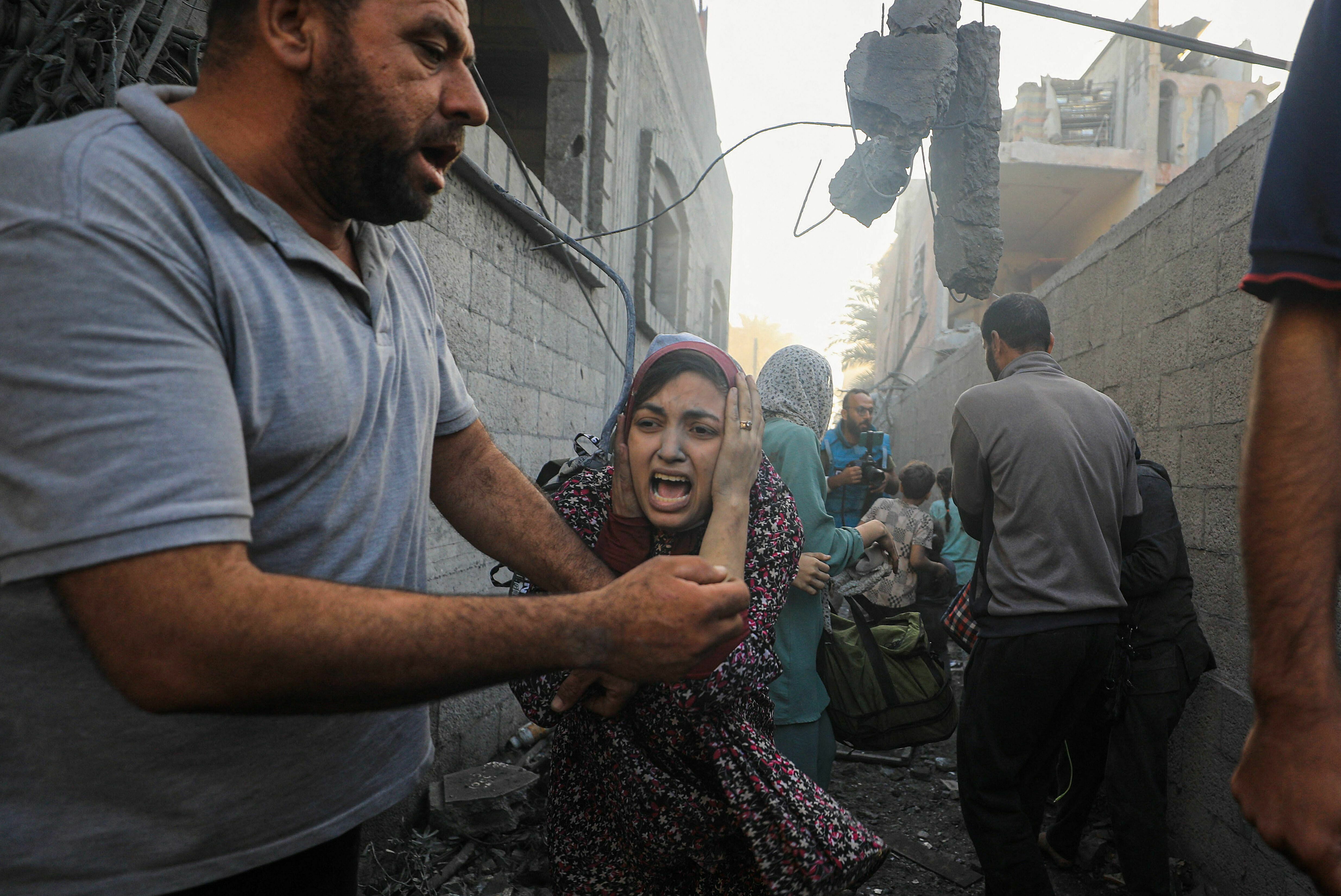 Mon., Nov. 6: People flee following Israeli air strikes on a neighbourhood in the al-Maghazi refugee camp in the central Gaza Strip.