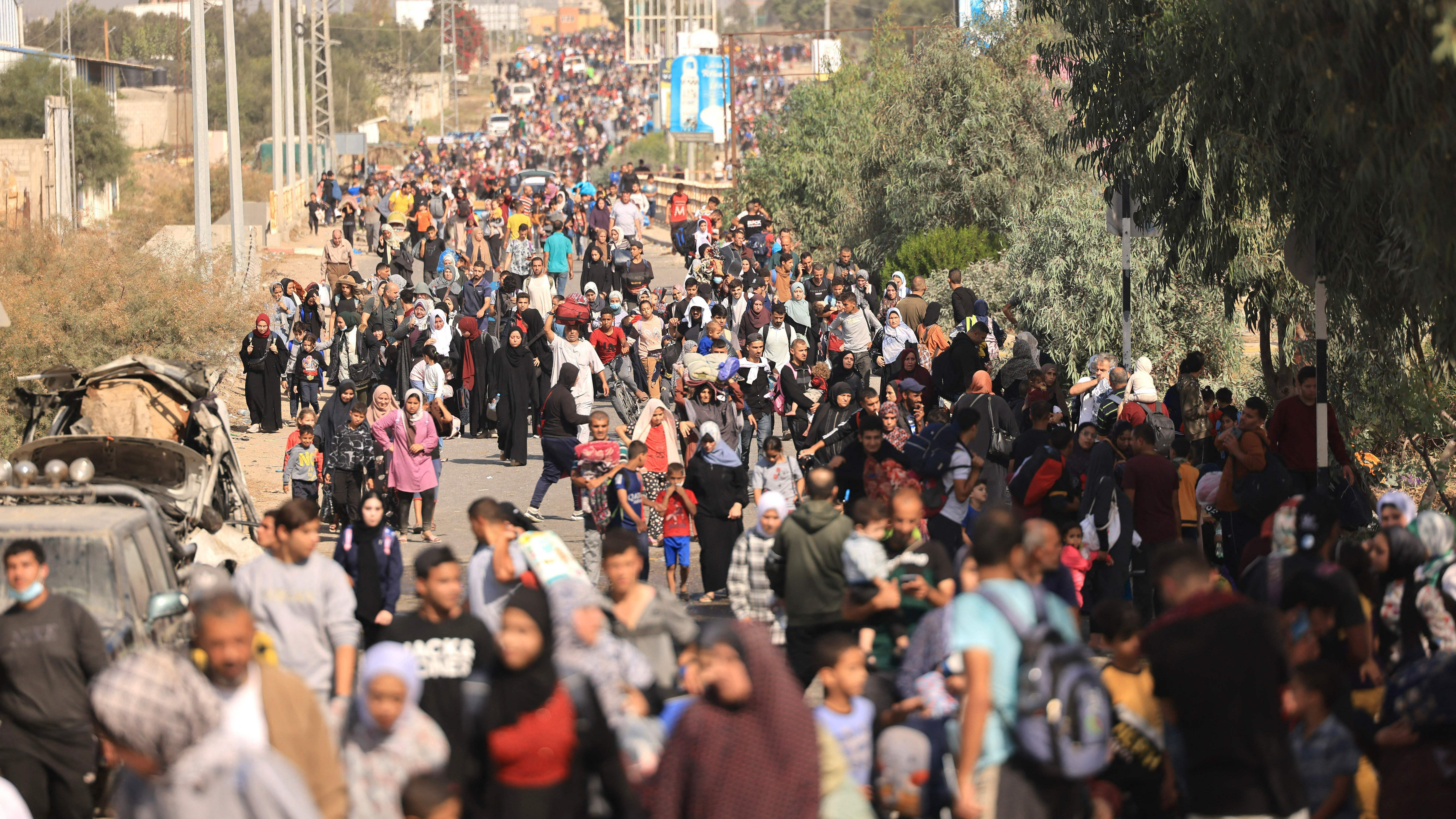 Thurs., Nov. 9: Palestinians families fleeing Gaza City and other parts of northern Gaza towards the southern areas, walk along a highway.