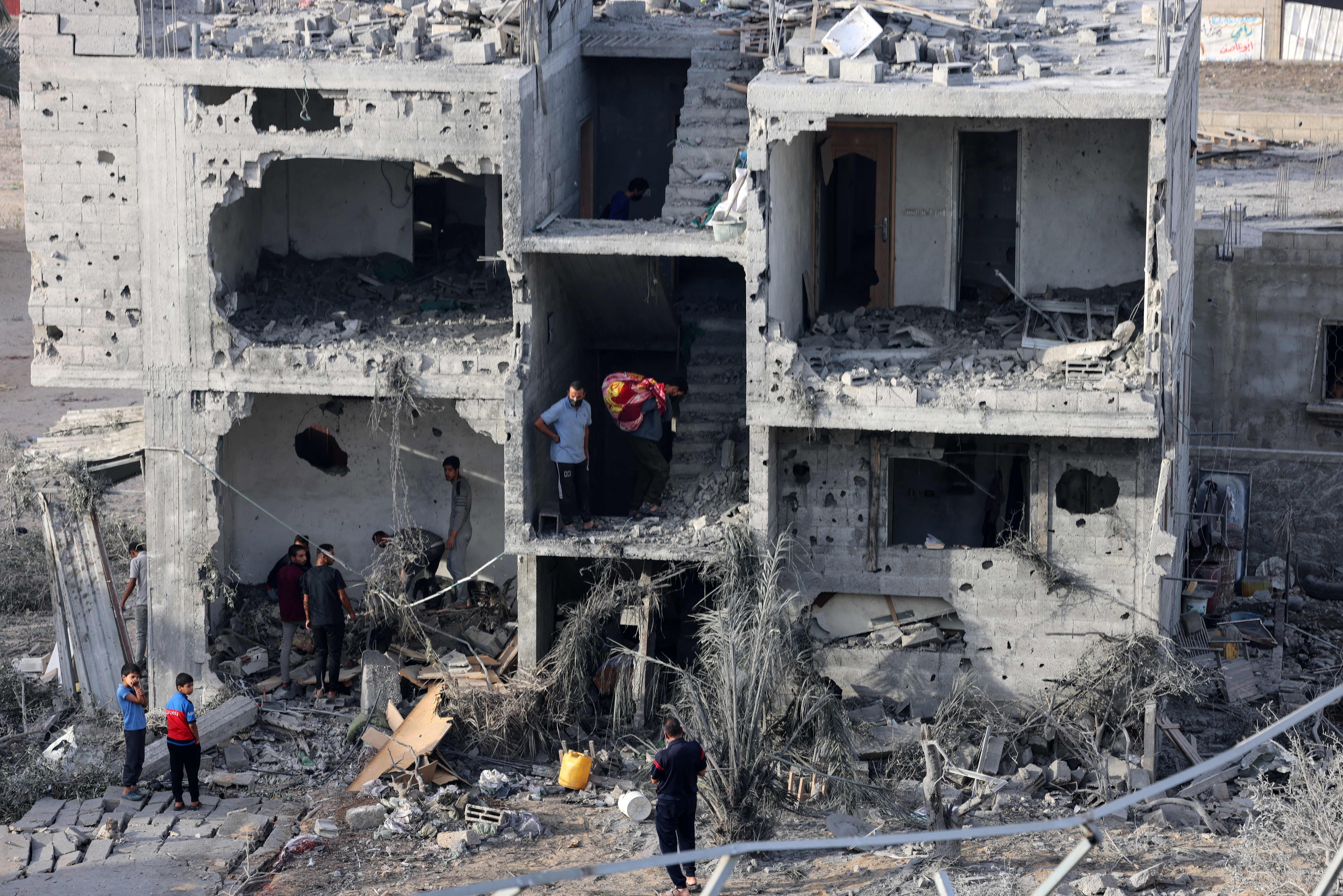 Sat., Nov. 11: People salvage some belongings from a damaged building following Israeli bombing on Rafah in the southern Gaza Strip.