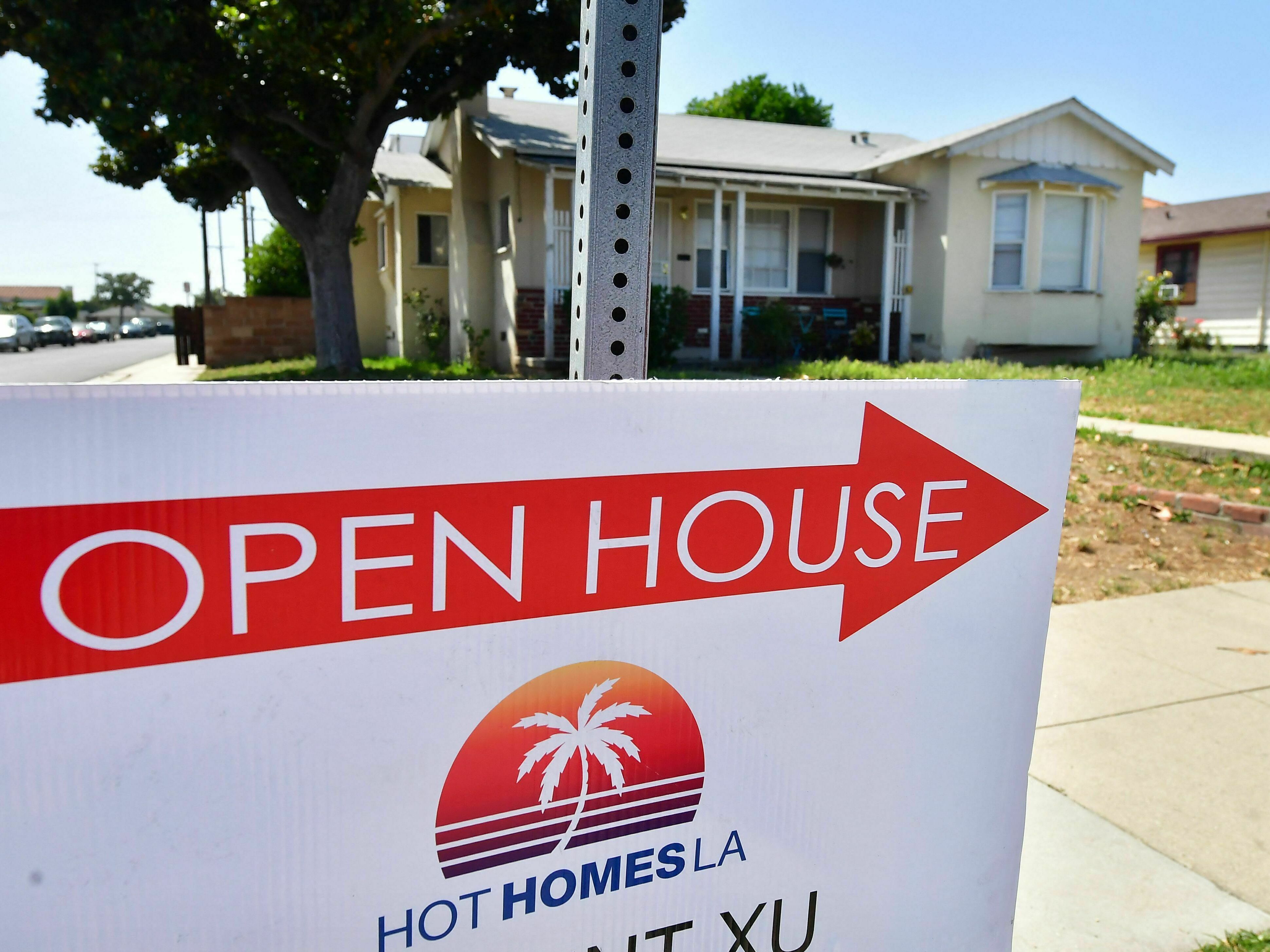 Would-be home buyers are battling high prices and high interest rates, but some are finding a way to make it work. (AFP via Getty Images)