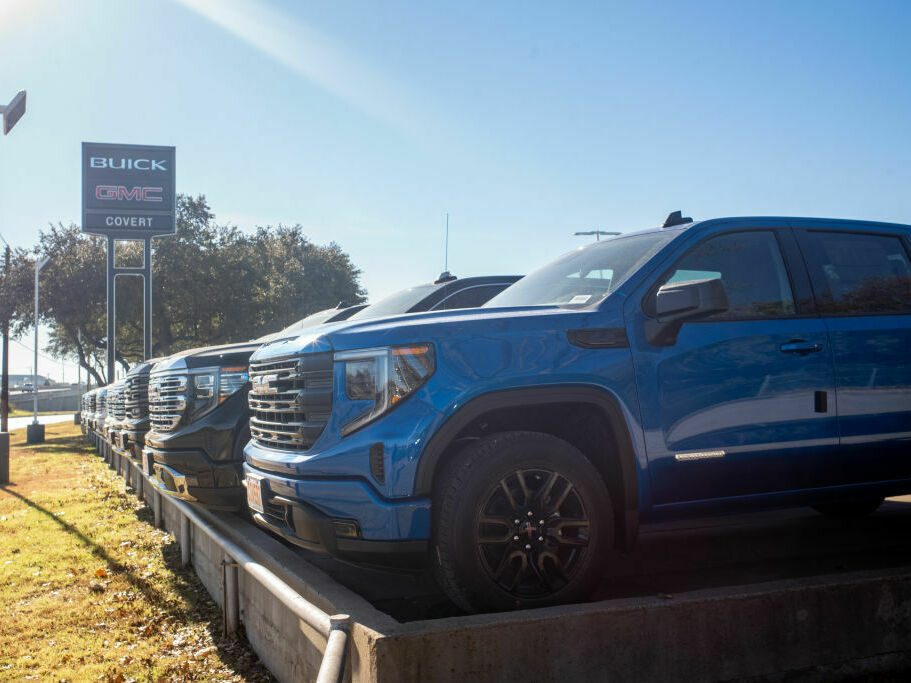 GMC pickup trucks on a lot at a General Motors dealership in Austin, Texas. The average U.S. passenger vehicle has gotten about 8 inches taller in the last 30 years, according to the Insurance Institute for Highway Safety. (Getty Images)