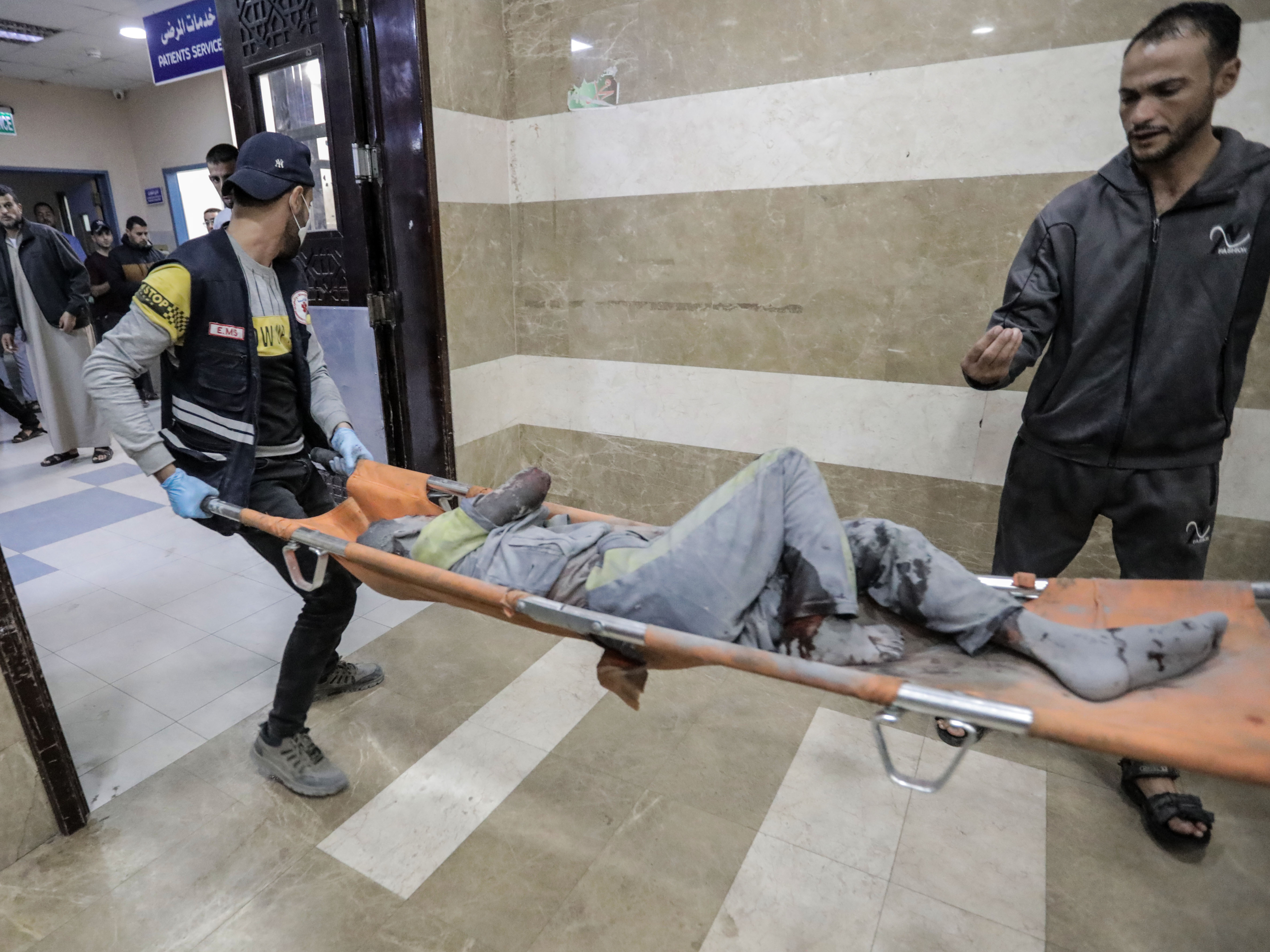 Palestinians injured in Israeli raids arrive at Nasser Medical Hospital on Tuesday in Khan Younis, Gaza. (Getty Images)