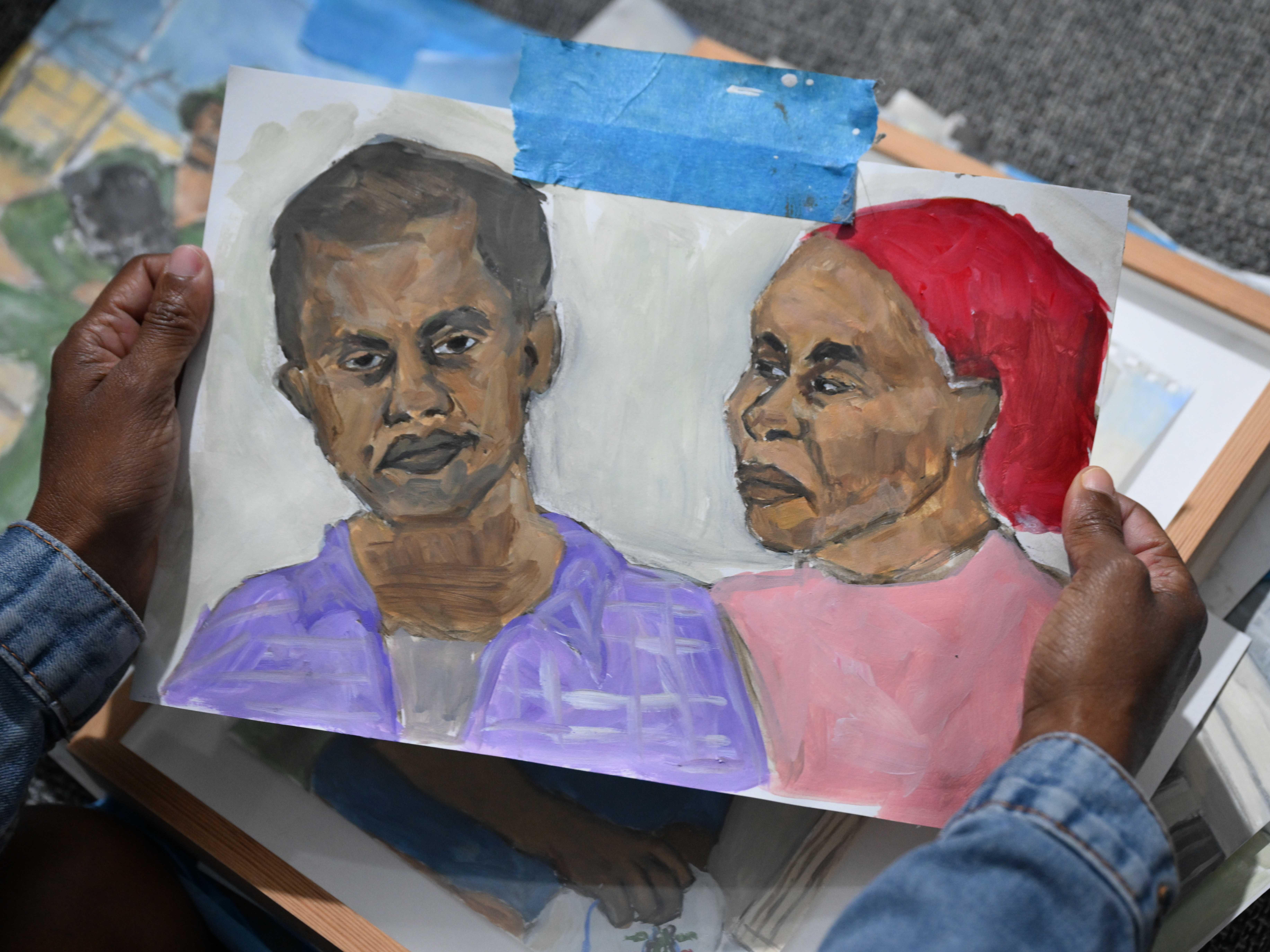 Michal Worke, an Israeli artist with Ethiopian roots, shares her studio space and artwork. Much of her work is devoted to a kidnapped Ethiopian Israeli citizen who has been held in Gaza for over nine years by Hamas. (Tanya Habjouqa/NOOR Images)