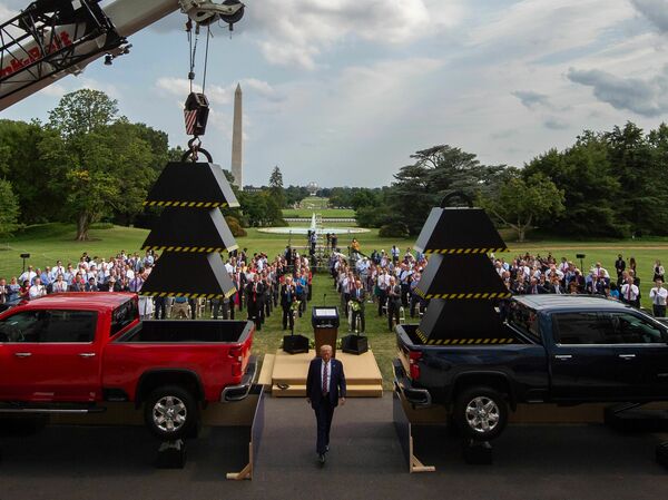 Then-President Donald Trump walks past weights and a crane after delivering remarks at the White House in July 2020.