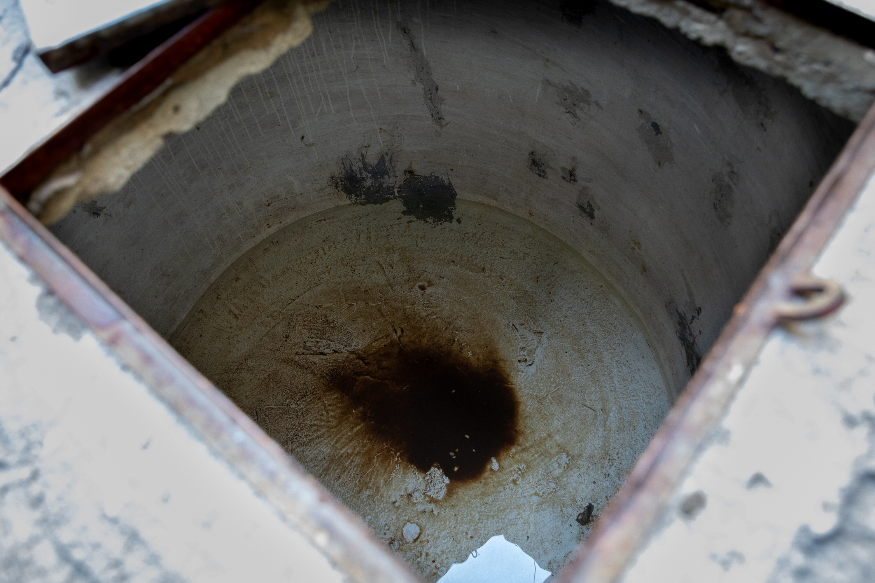 The alberca outside Ana Troncoso's home is nearly empty — until the next water delivery arrives. There's just enough water at the bottom to keep the cistern from cracking in the summer heat.
