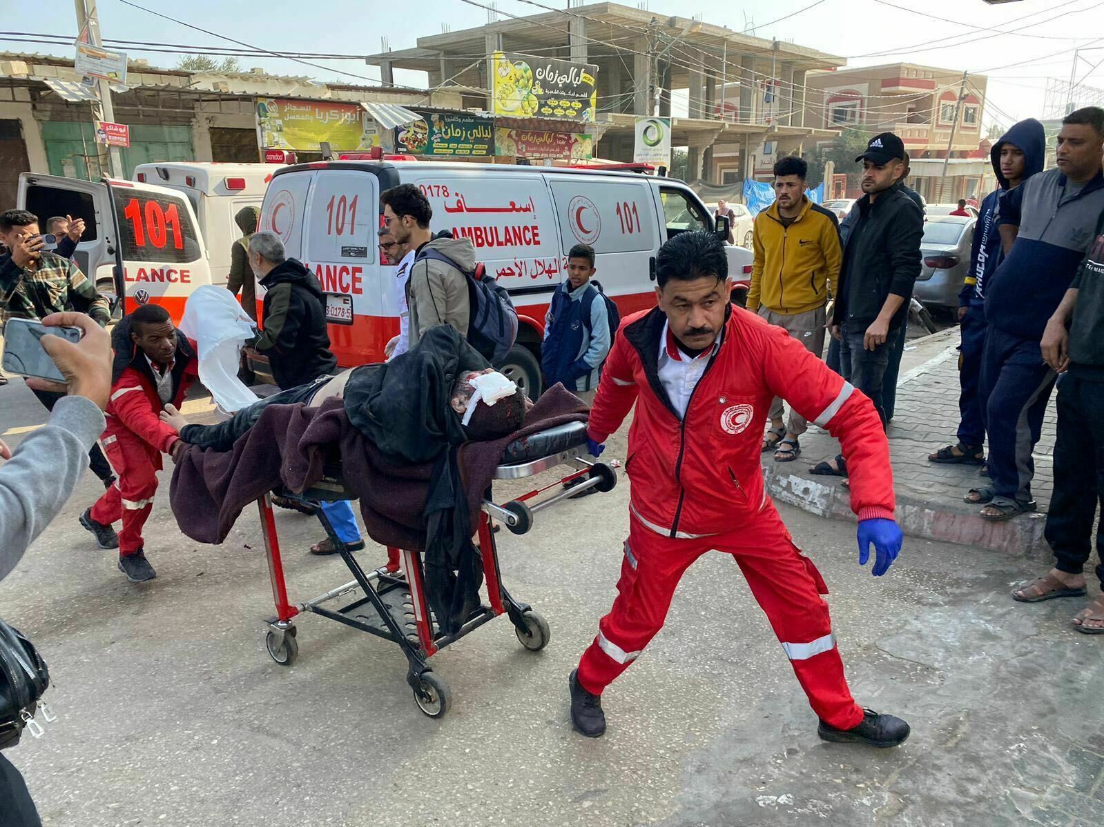 Workers rush injured people to Mohammed Yousef al-Najjar Hospital in Rafah as Israel resumed its bombing Friday morning in the Gaza Strip. (Anas Baba/NPR)