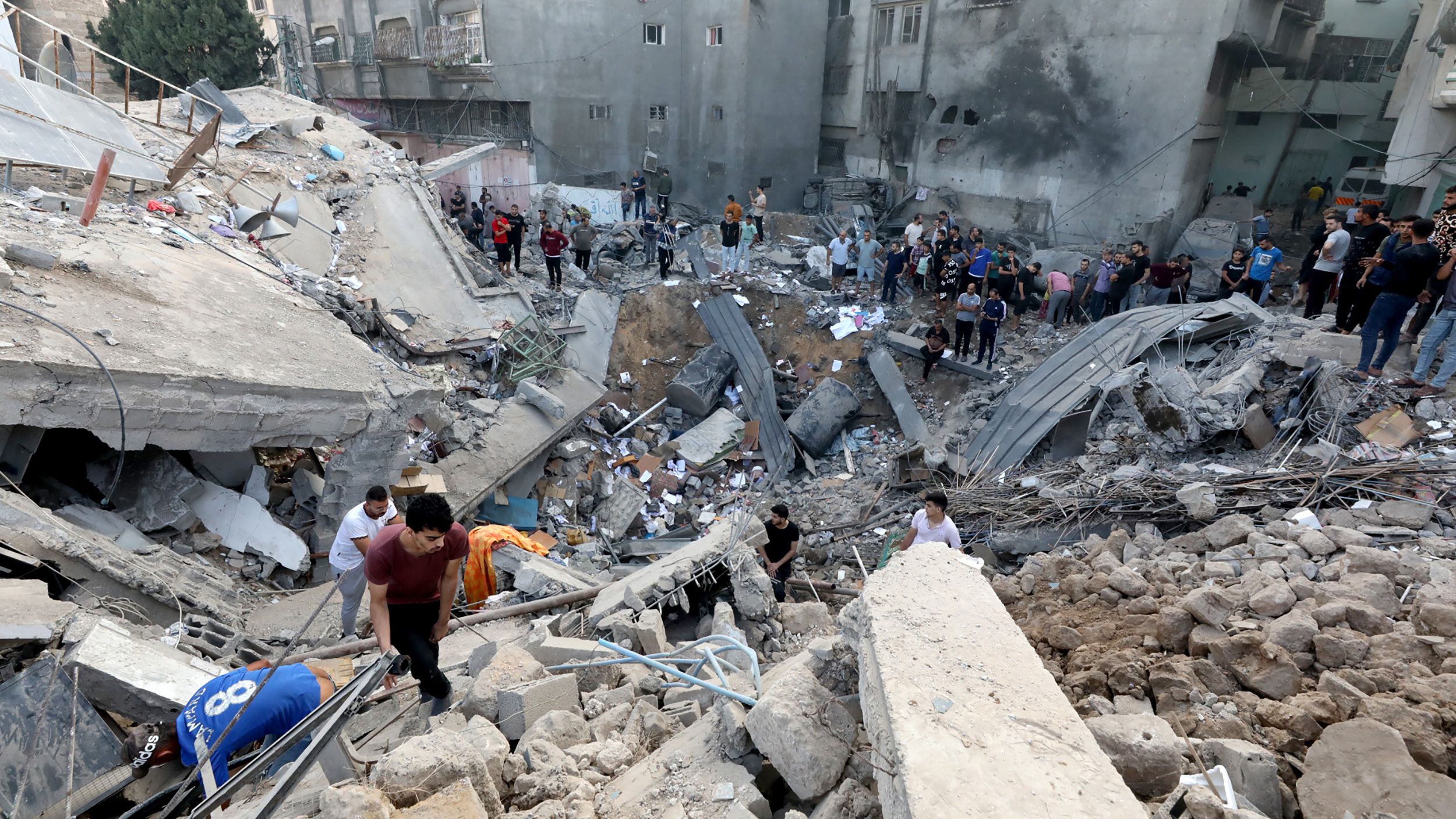 Palestinians search the destroyed annex of the Church of Saint Porphyrius, damaged in a strike on Gaza City on Oct. 20.