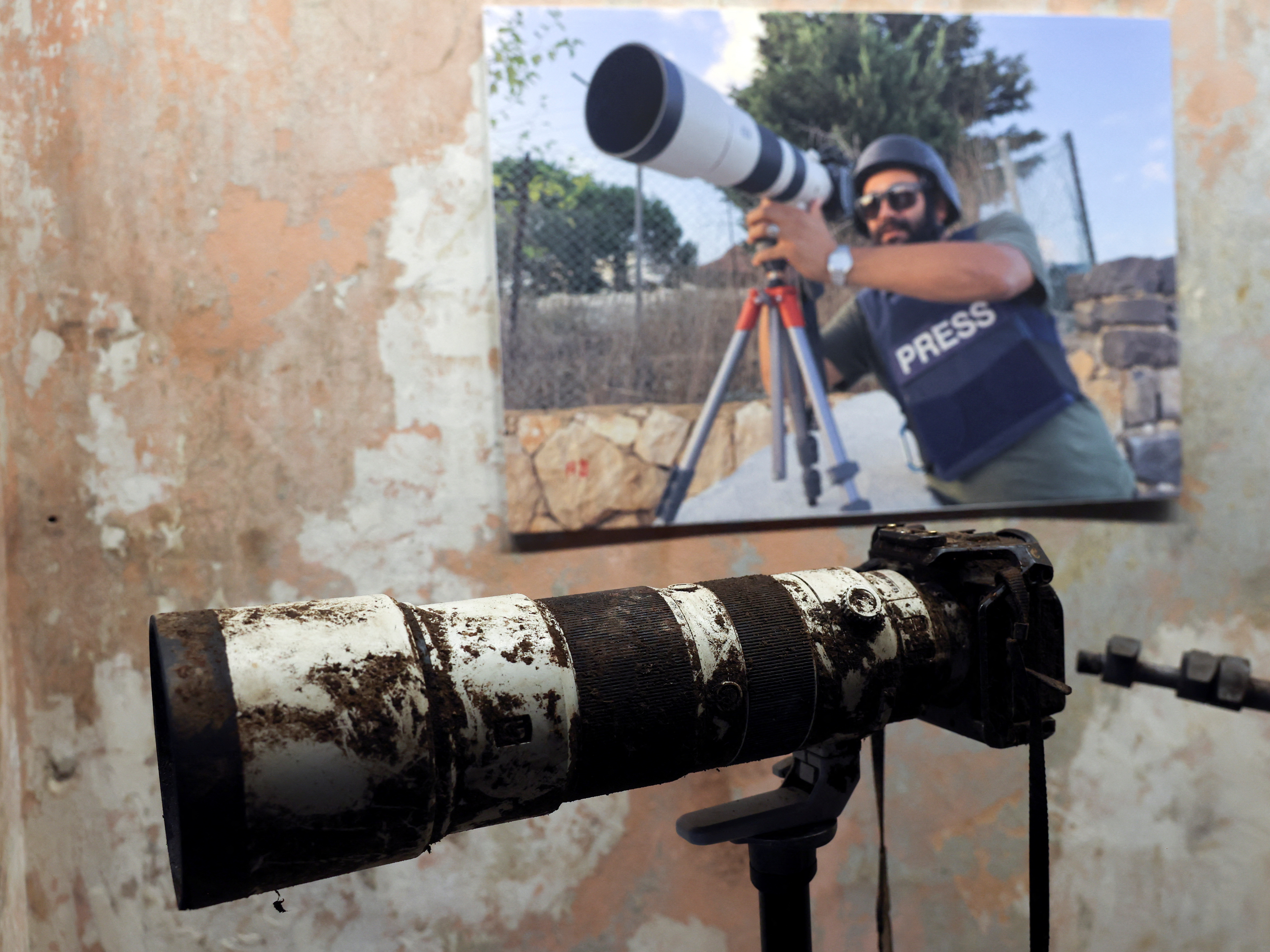The camera that belonged to Reuters journalist Issam Abdallah, who was killed by what a Reuters investigation has found was an Israeli tank crew, is displayed during a press conference by Amnesty International and Human Rights Watch in Beirut, Lebanon, on Thursday. (Reuters)