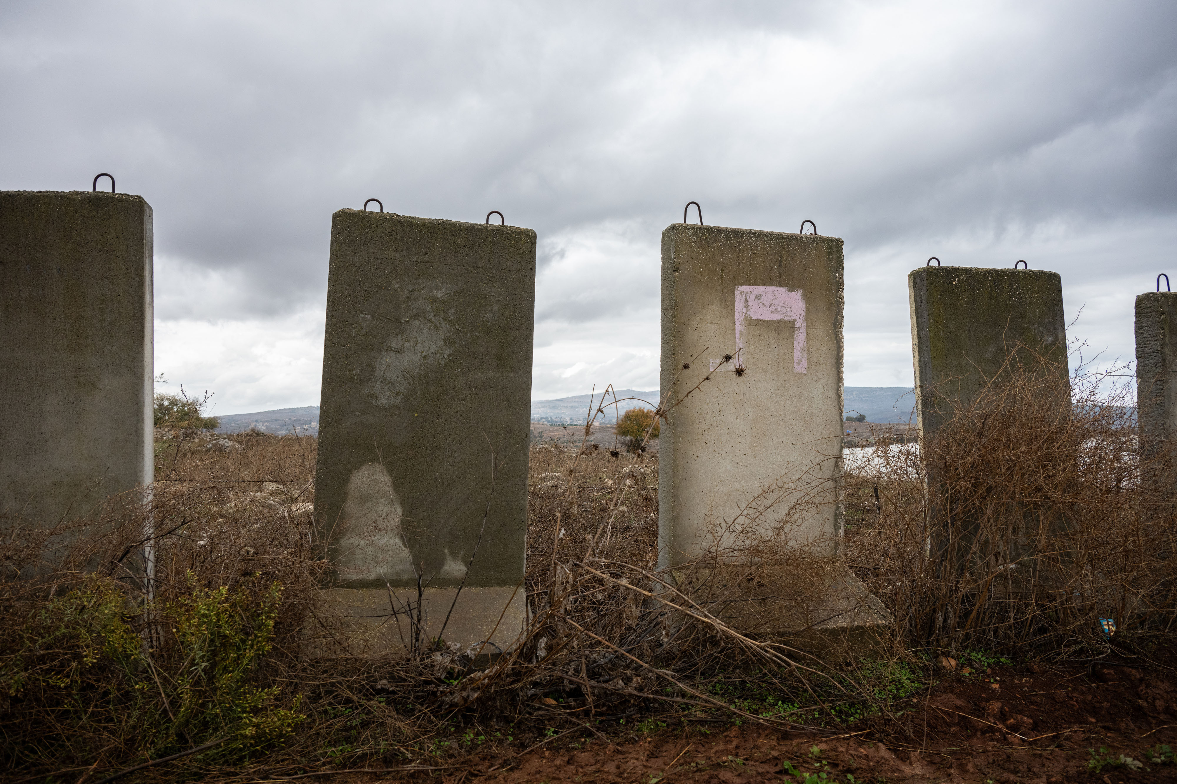 Concrete barriers line a road near the border with Lebanon in northern Israel on Nov. 28. (Tamir Kalifa for NPR)
