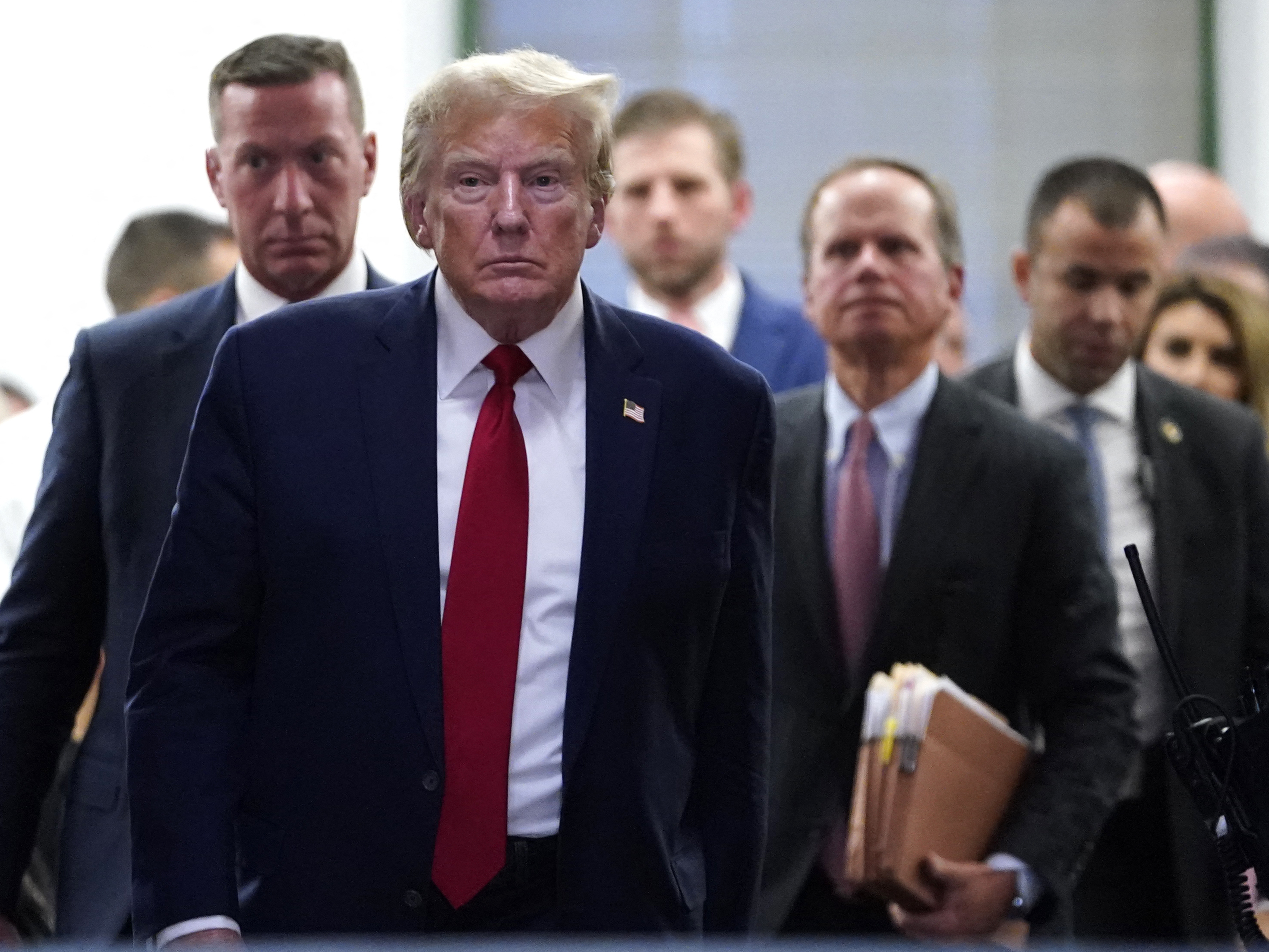 Former President Donald Trump departs for a break during his civil fraud trial in New York City on Thursday. (AFP via Getty Images)