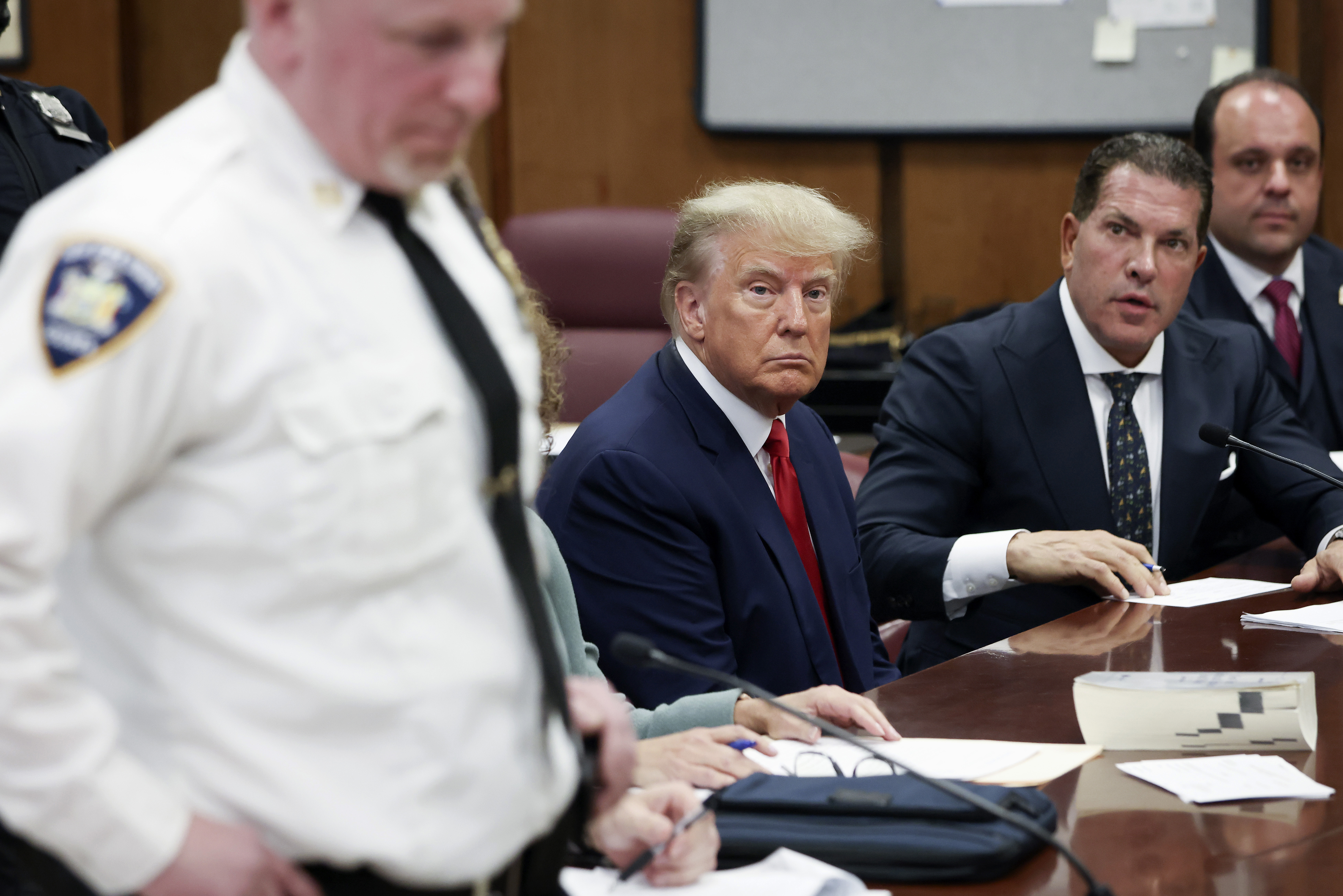 Former President Donald Trump sits in the courtroom with his attorneys Joe Tacopina and Boris Epshteyn (right) during his arraignment at the Manhattan Criminal Court on April 4 in New York City. (Getty Images)
