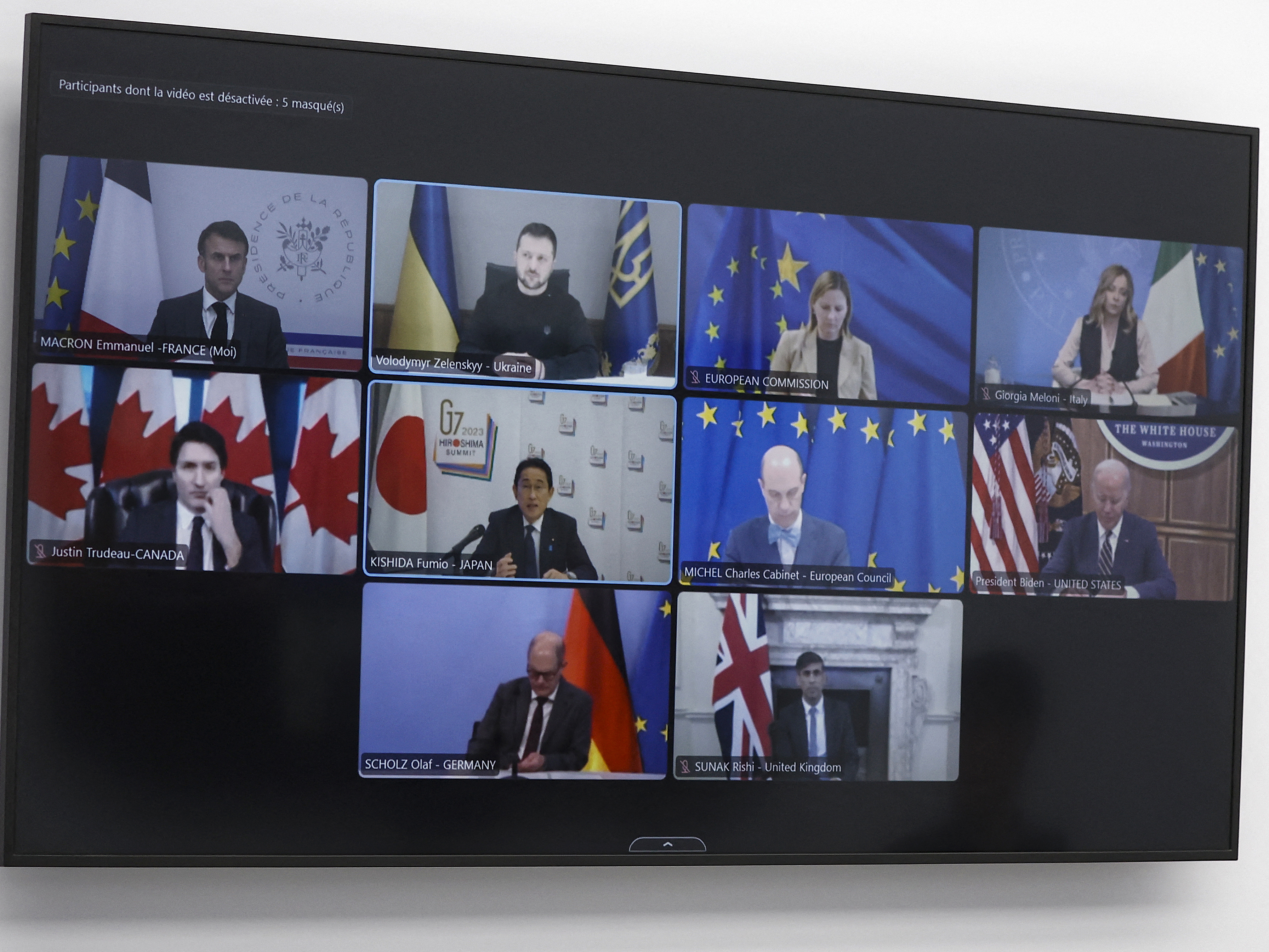 Ukrainian President Volodymyr Zelenskyy addresses leaders by video during a G7 leaders summit in Paris on Dec. 6.