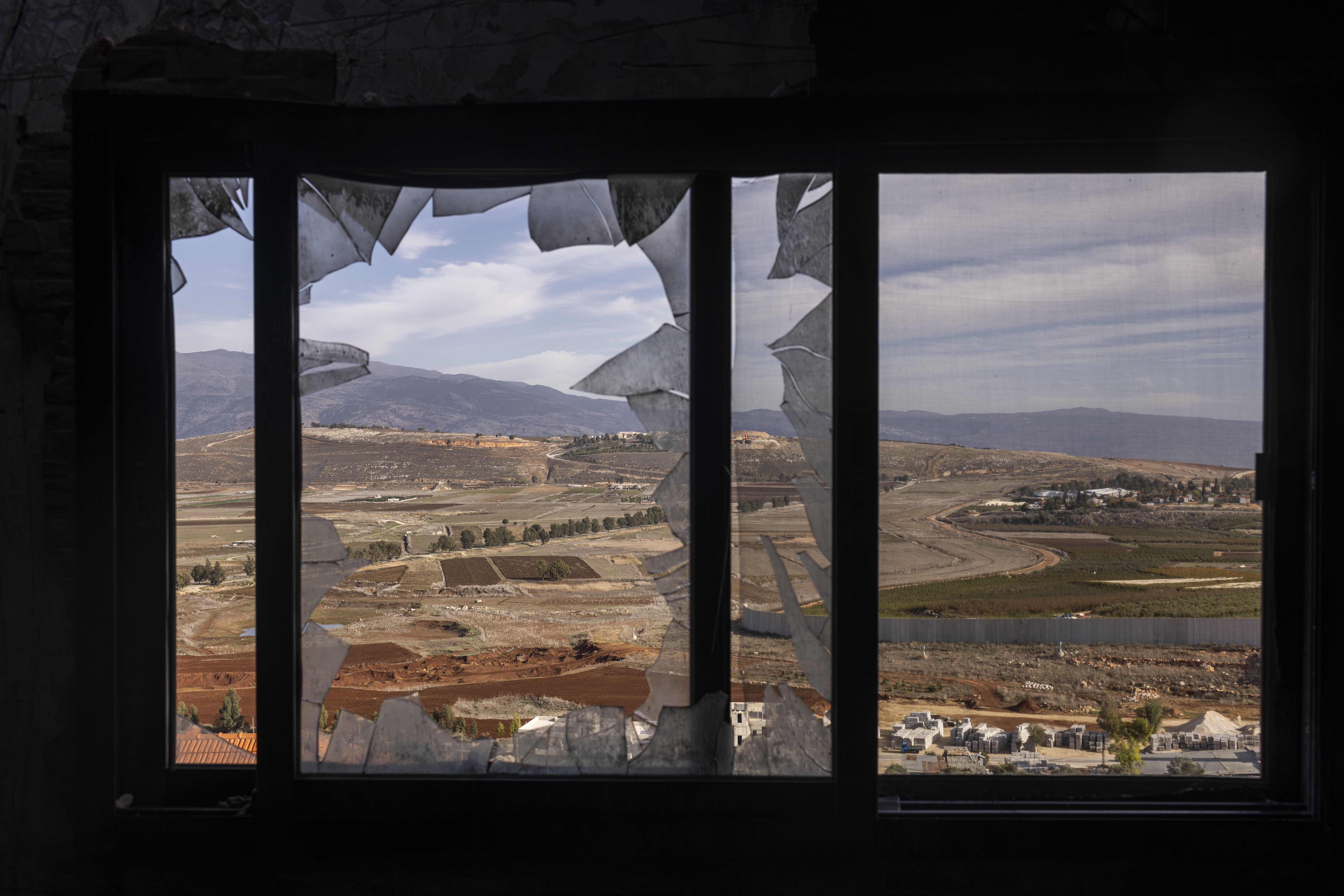 A heavily damaged house after an Israeli attack in Kfar Kela, southern Lebanon, near a wall that Israel built along the countries' border, on Nov. 30. (Diego Ibarra Sánchez for NPR)